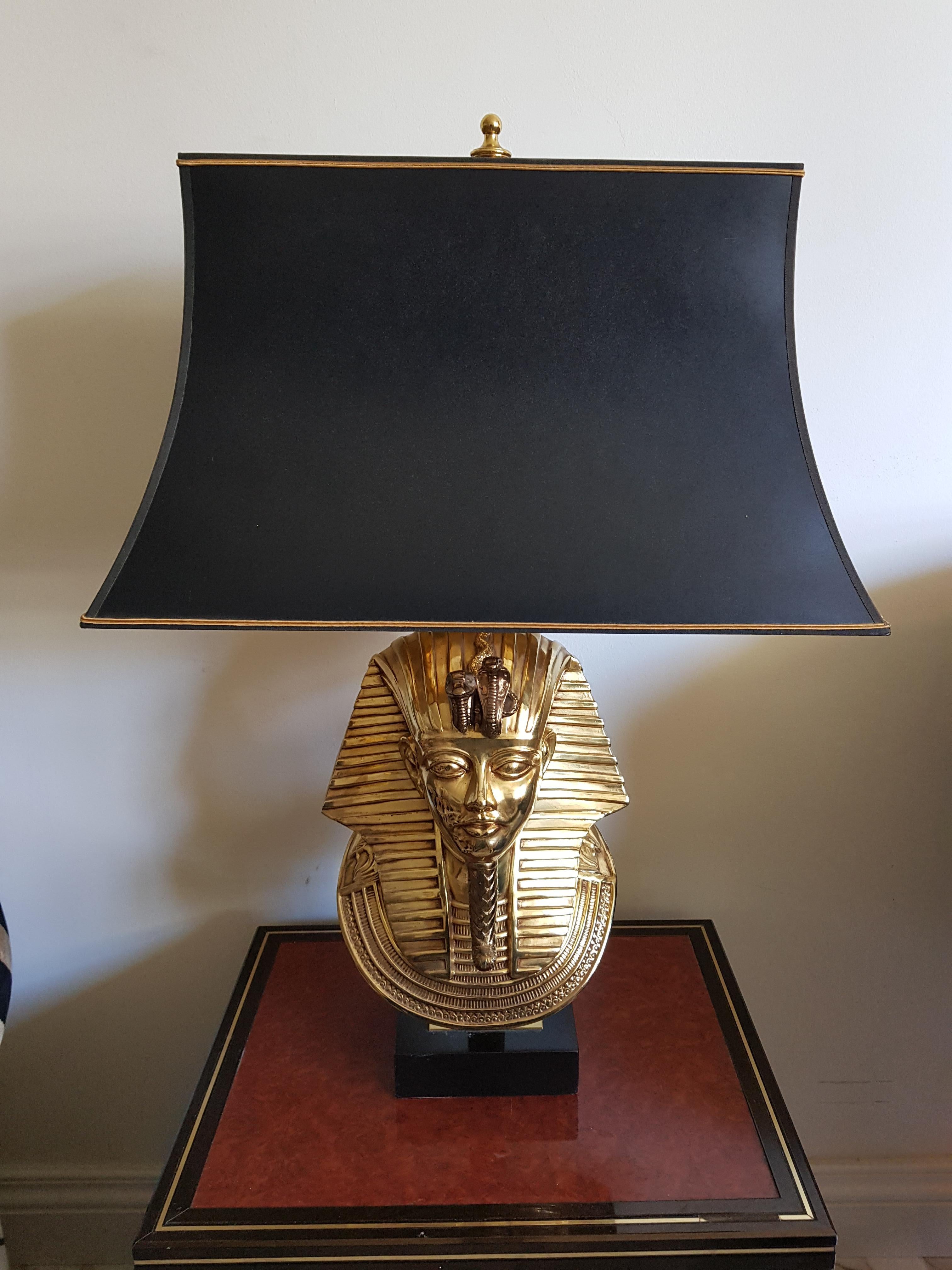 A pair of brass Hollywood Regency style table lamps, pharaoh heads made by Belgium manufacturer Deknudt, and these lamps are very detailed as you see in the picture.
One lamp has more vintage look and the other one looks newer but this is always