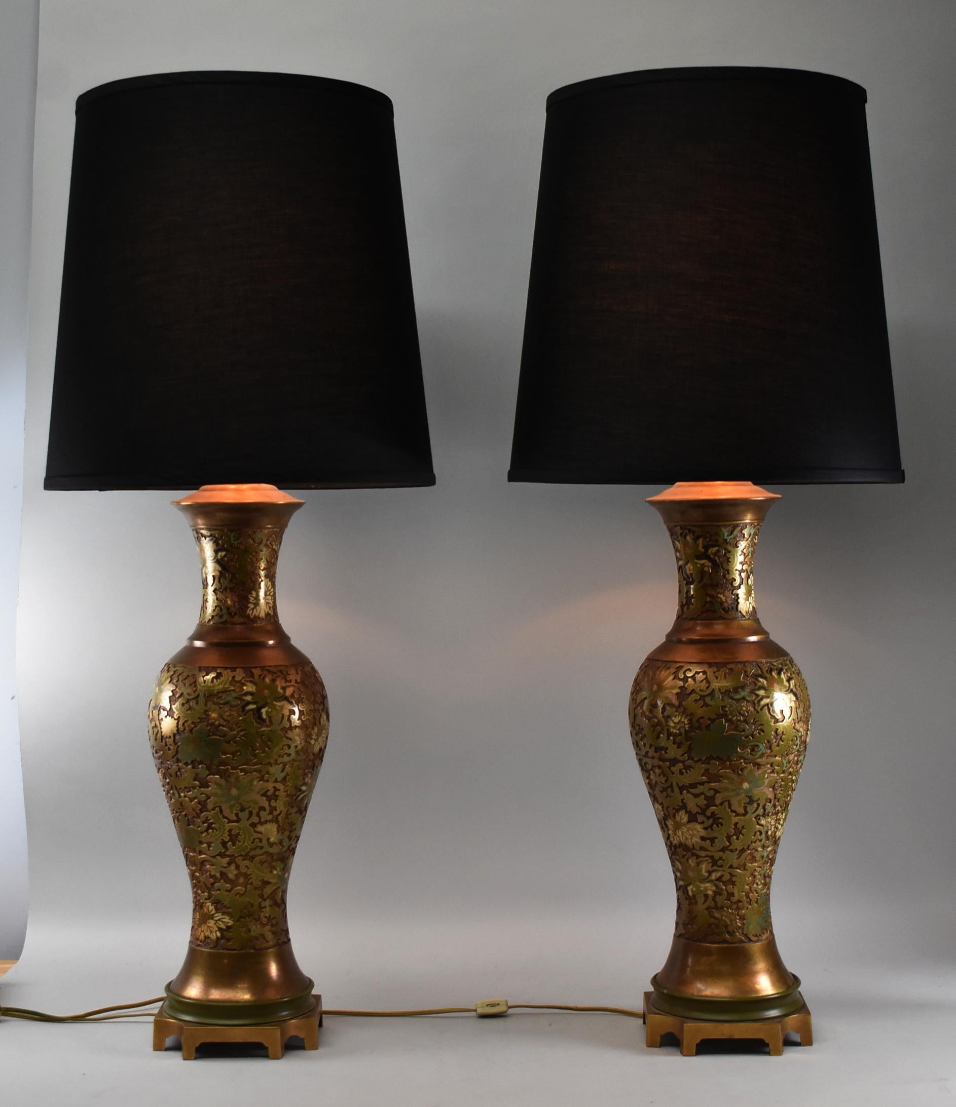 Pair of Marbo brass enamel floral design two socket table lamps. Ginger jar Asian shaped base with black linen shades.