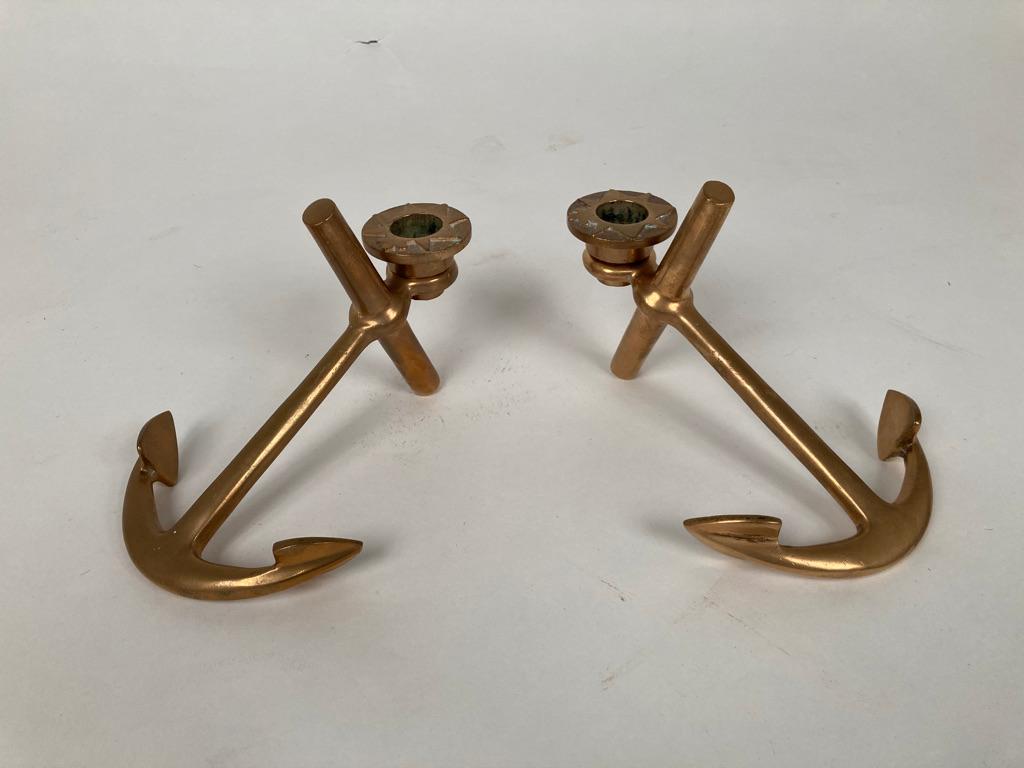 Unusual pair of candlesticks in the form of ships anchors with removable bobeches showing compass points. A must-have for the sailing or boating aficionado.