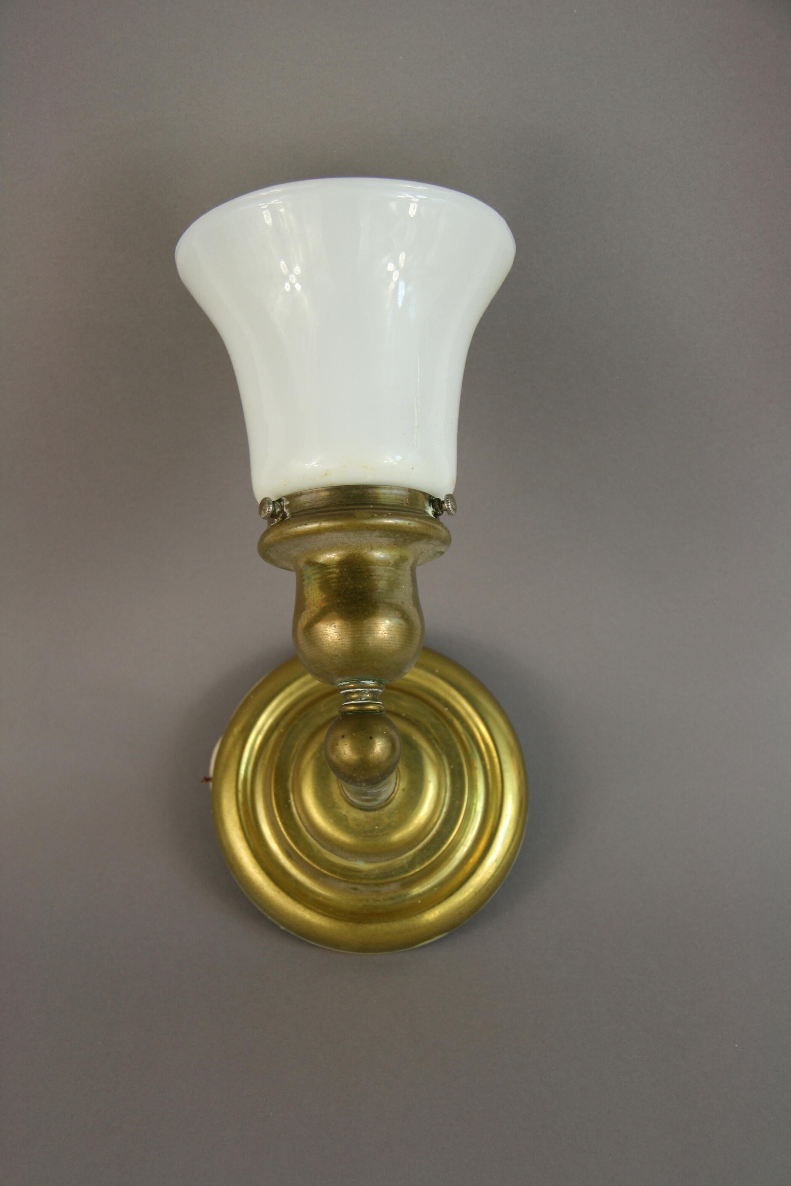 3-359 Pair of brass shades with white glass shades
Rewired
Takes one 60 watt bulb.