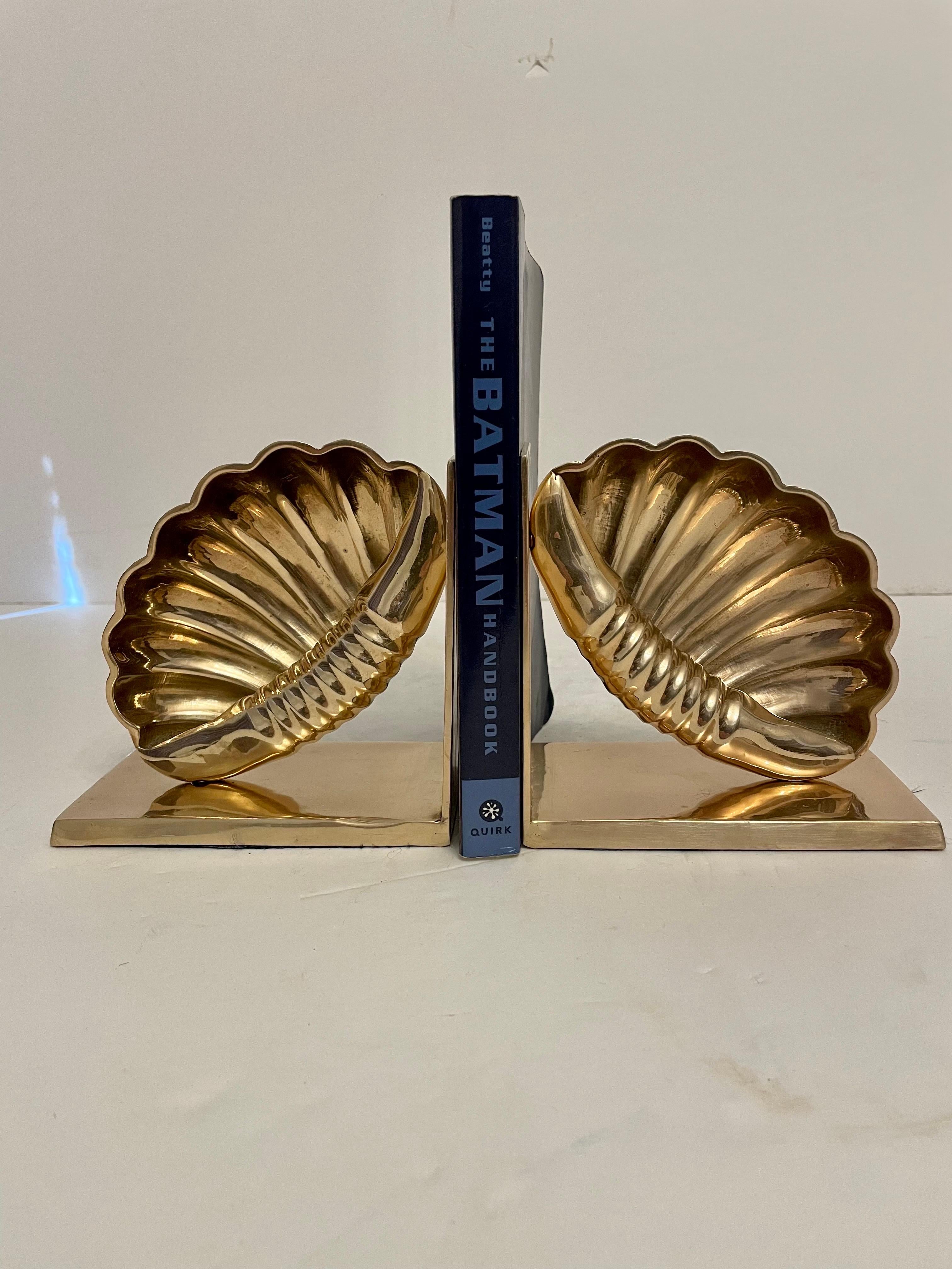 Brass nautical bookends. Nice detail in casting, heavy weight with substantial feel. Holds a shelves worth of books. Felt on bottoms as shown. Good condition, some light patina. Great for your beach house! 

Each bookend is 5” W x 5 H x 3” deep (10”