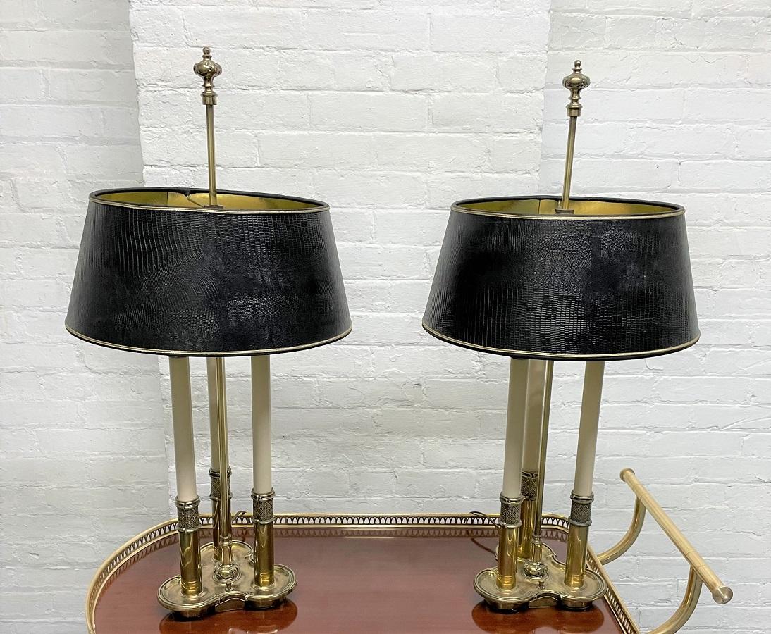 Pair of brass stiffel lamps. Lamps have three sockets and well designed.
Shades included.