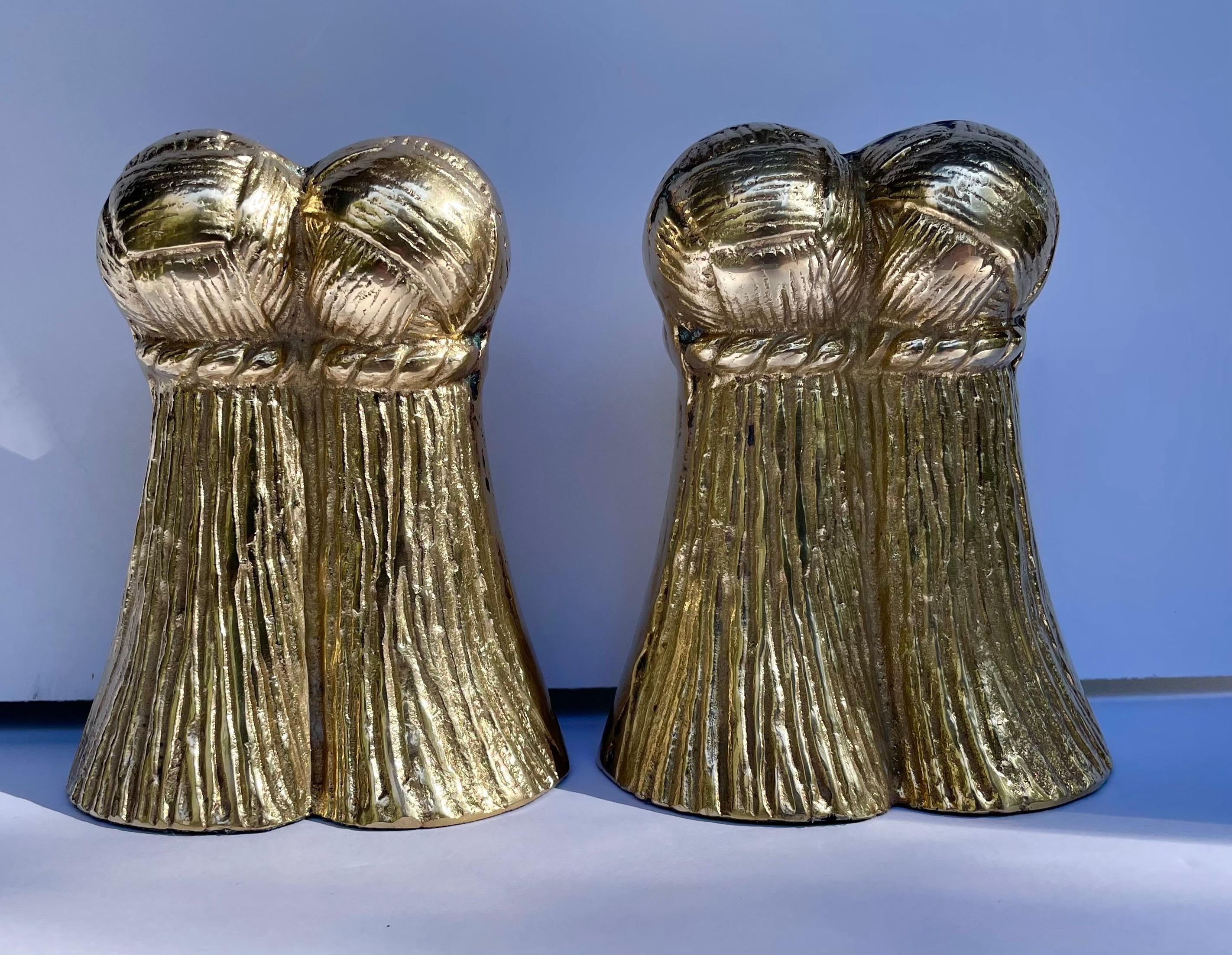 Brass Tassel Bookends. Nice weight to hold a stack of books. Good overall condition. Dark and light spots are reflection. Hand polished. 