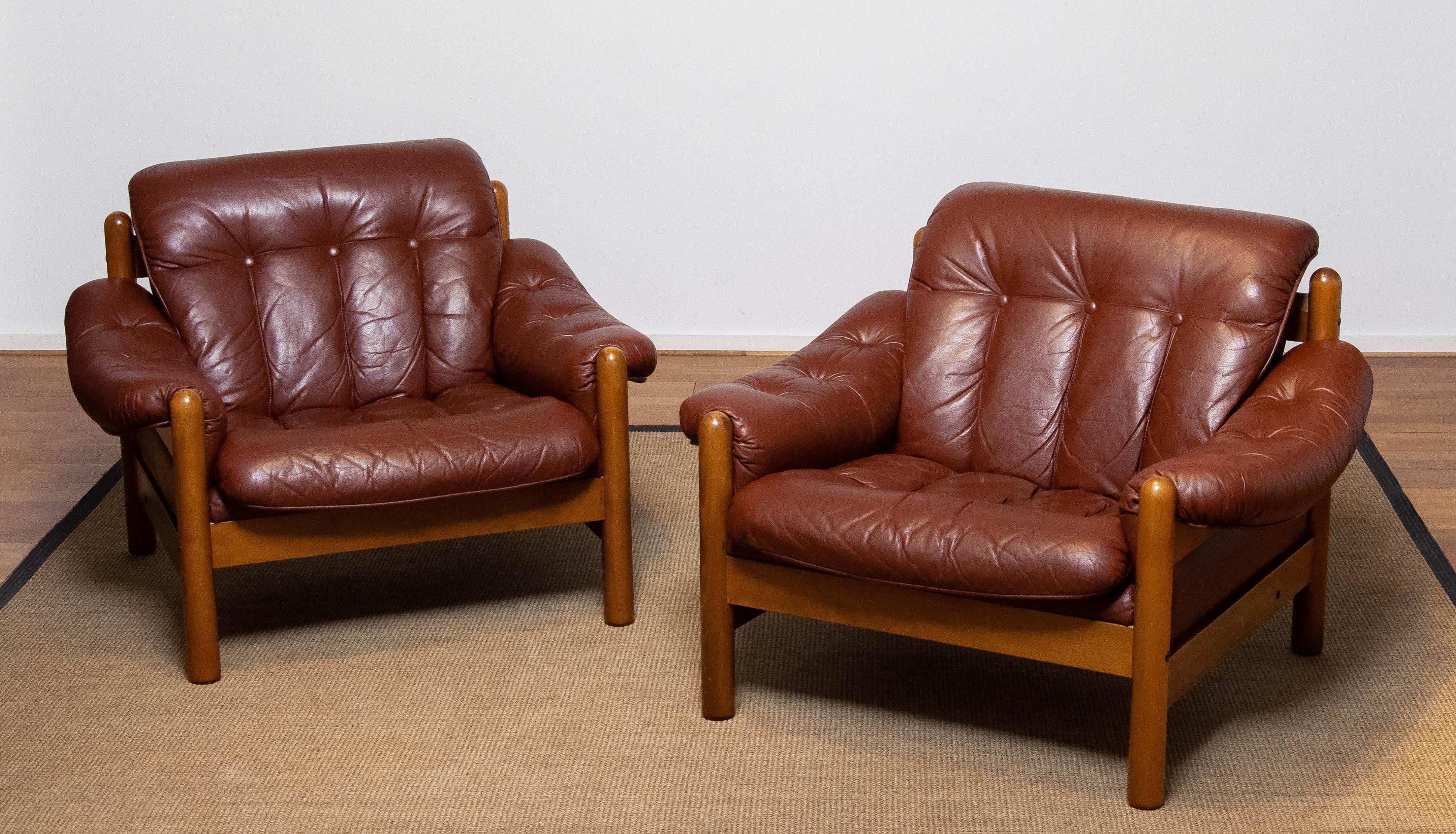 Beautiful pair Brutalist / Brazilian style lounge chairs made by Göte Möbler Nässjö in Sweden in brown leather. The wooden construction is made of beech. Both sits absolutely comfortable even for a longer period. Allover in very good condition but