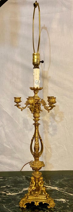 Pair of Bronze 1920s Electrified Candelabra Lamps, Full Figure Fluted Cherubs