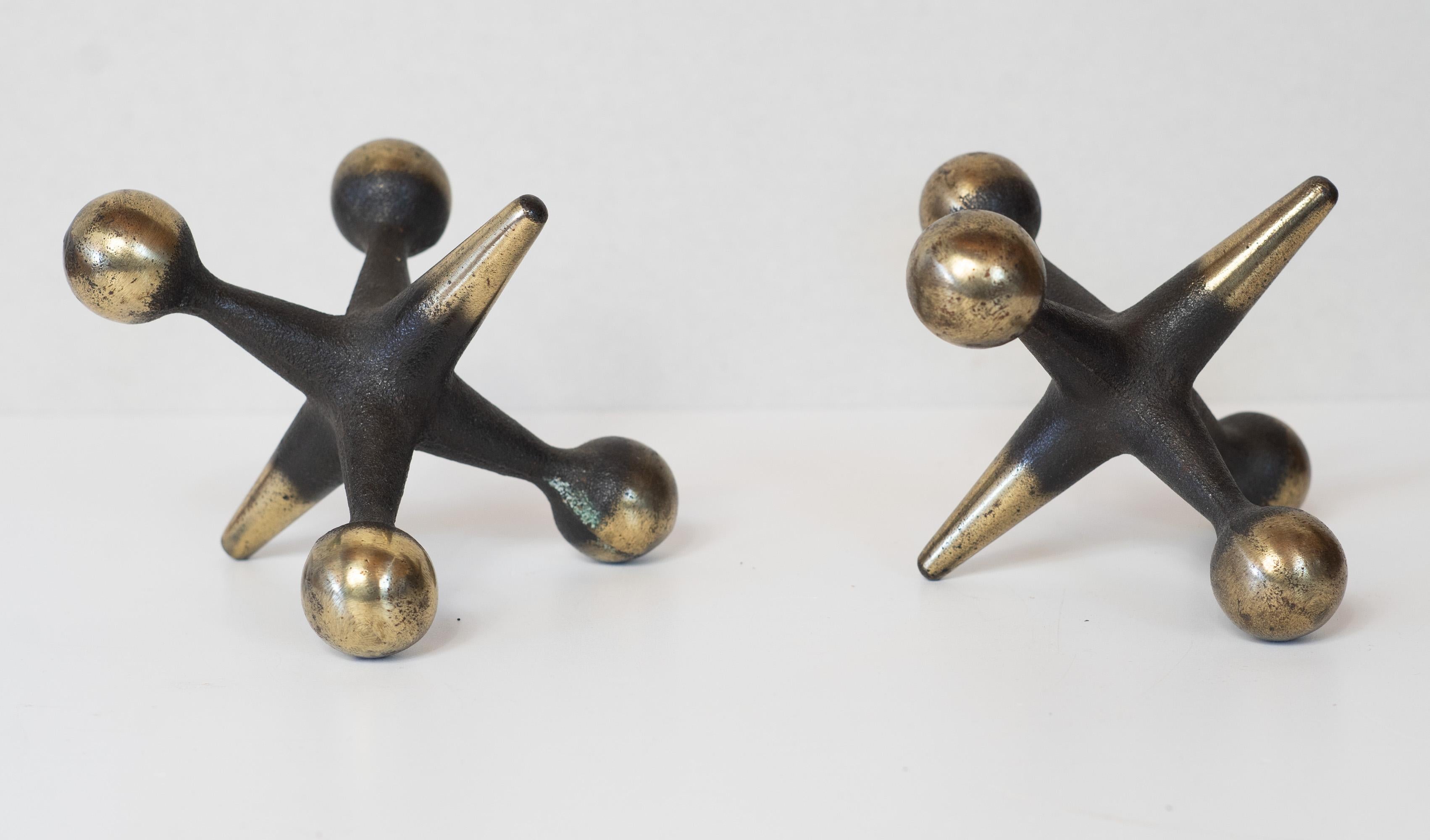 Designed by Bill Curry, these oversize jacks were made by Design Line in California. Many variants of these exist, but all were made the same way. First, the general shape is cast, as shown by the casting marks on the jacks, then they were placed in