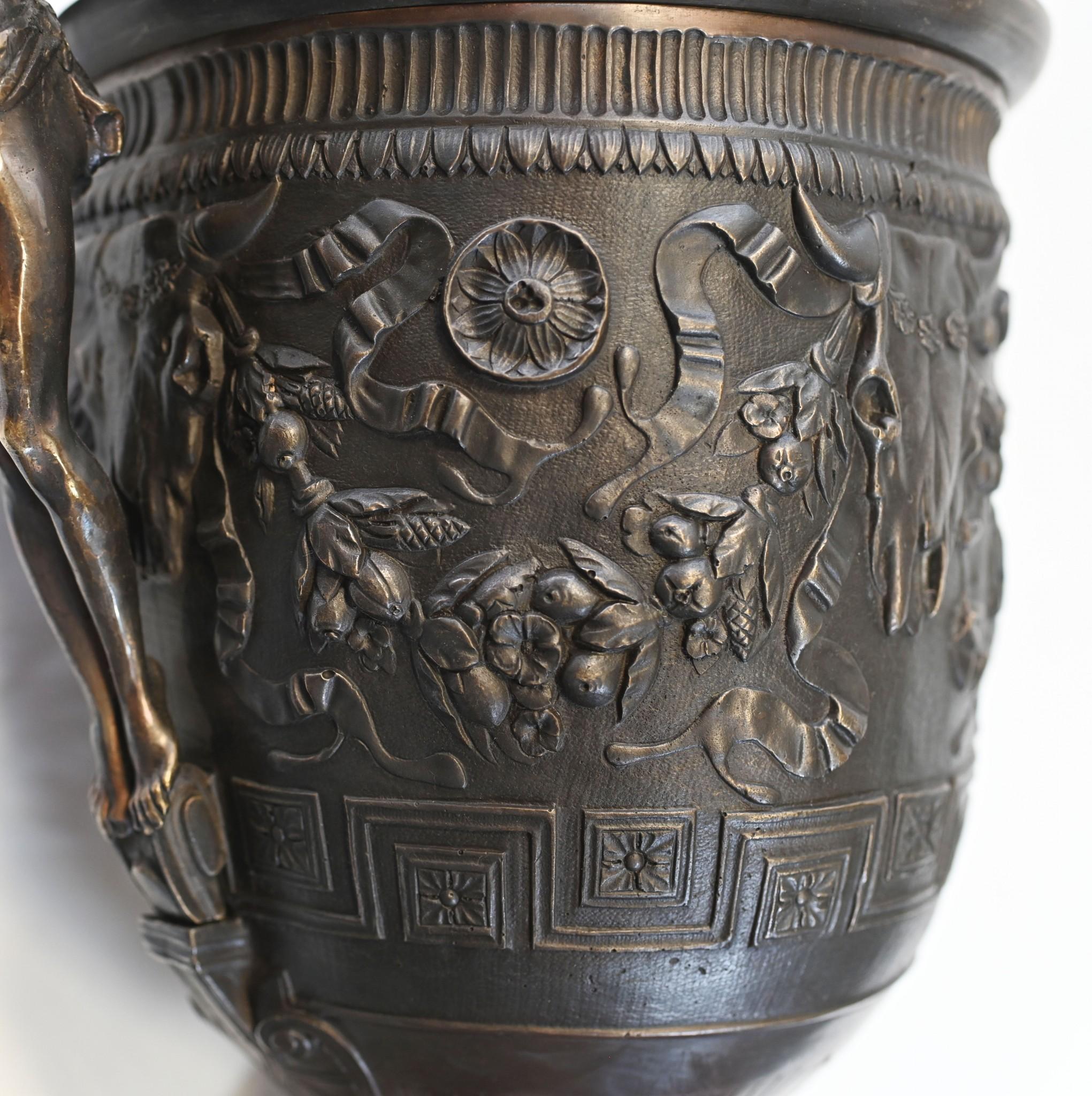 You are viewing a gorgeous pair of classical Grand Tour urns in bronze
Classic campana form flanked by the male figurines as handles
Stands on the red marble bases which are smooth and chip free
The casting is superb, look at all the relief work to