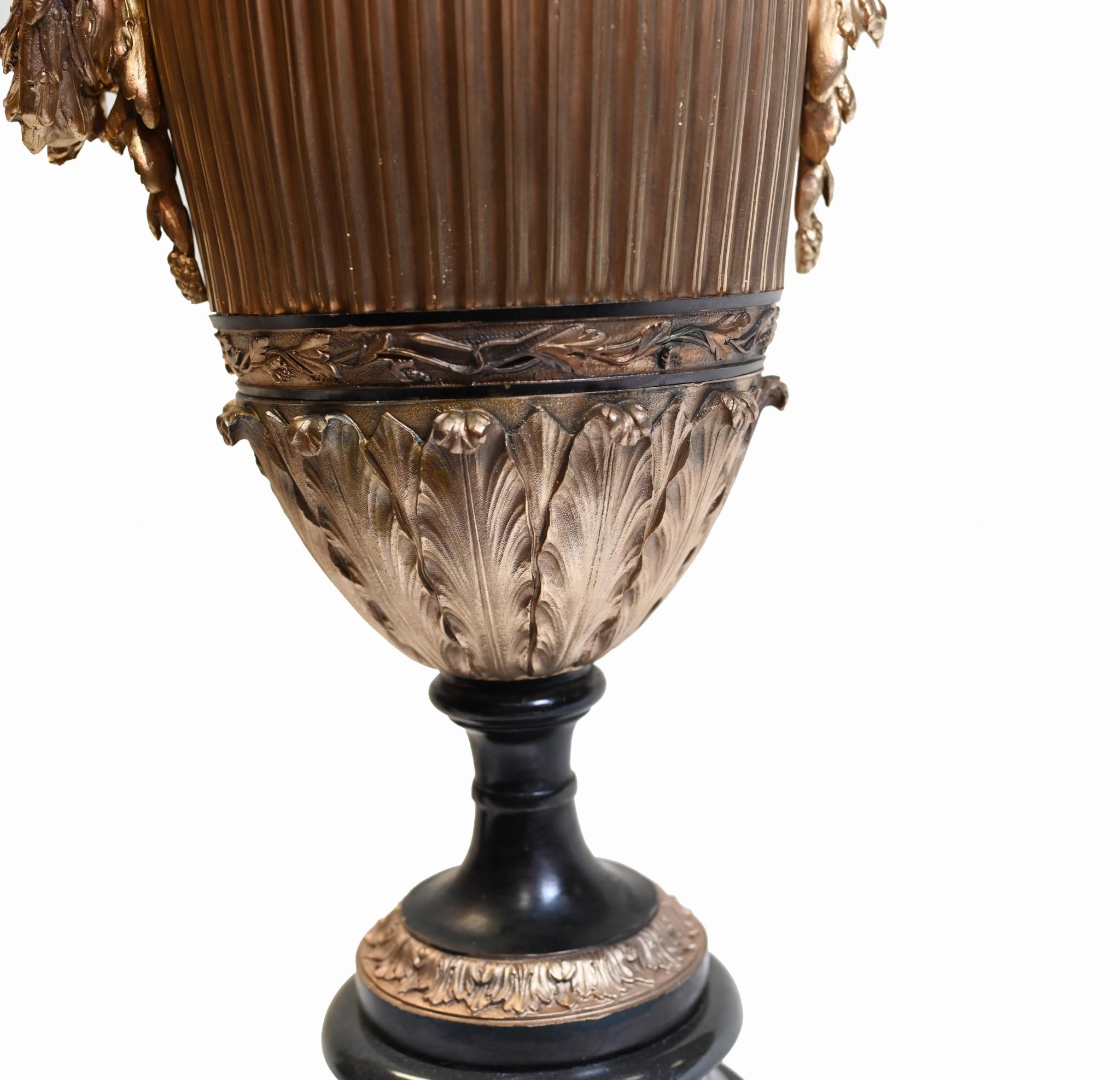 Wow - these would certainly take centre stage in any room
You are viewing a classic pair of gilt and bronze urns of amphora form
In the Grecian style, these would add classical elegance to any room or interiors scheme
Feature domed tops surmounted