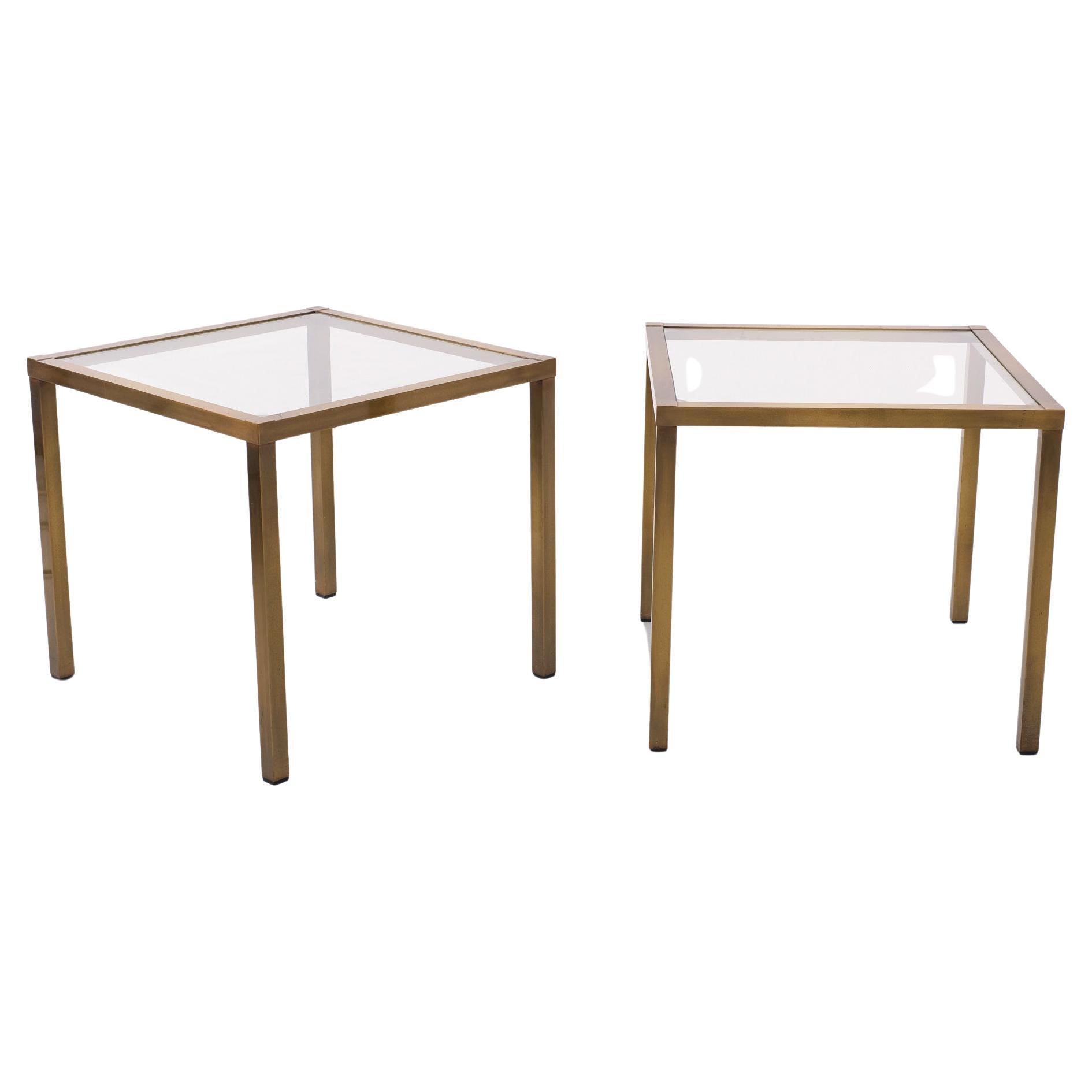 Very nice pair of side tables .Brass with a a Bronze color .
Square frame . so stylish .New Clear Glass tops .   