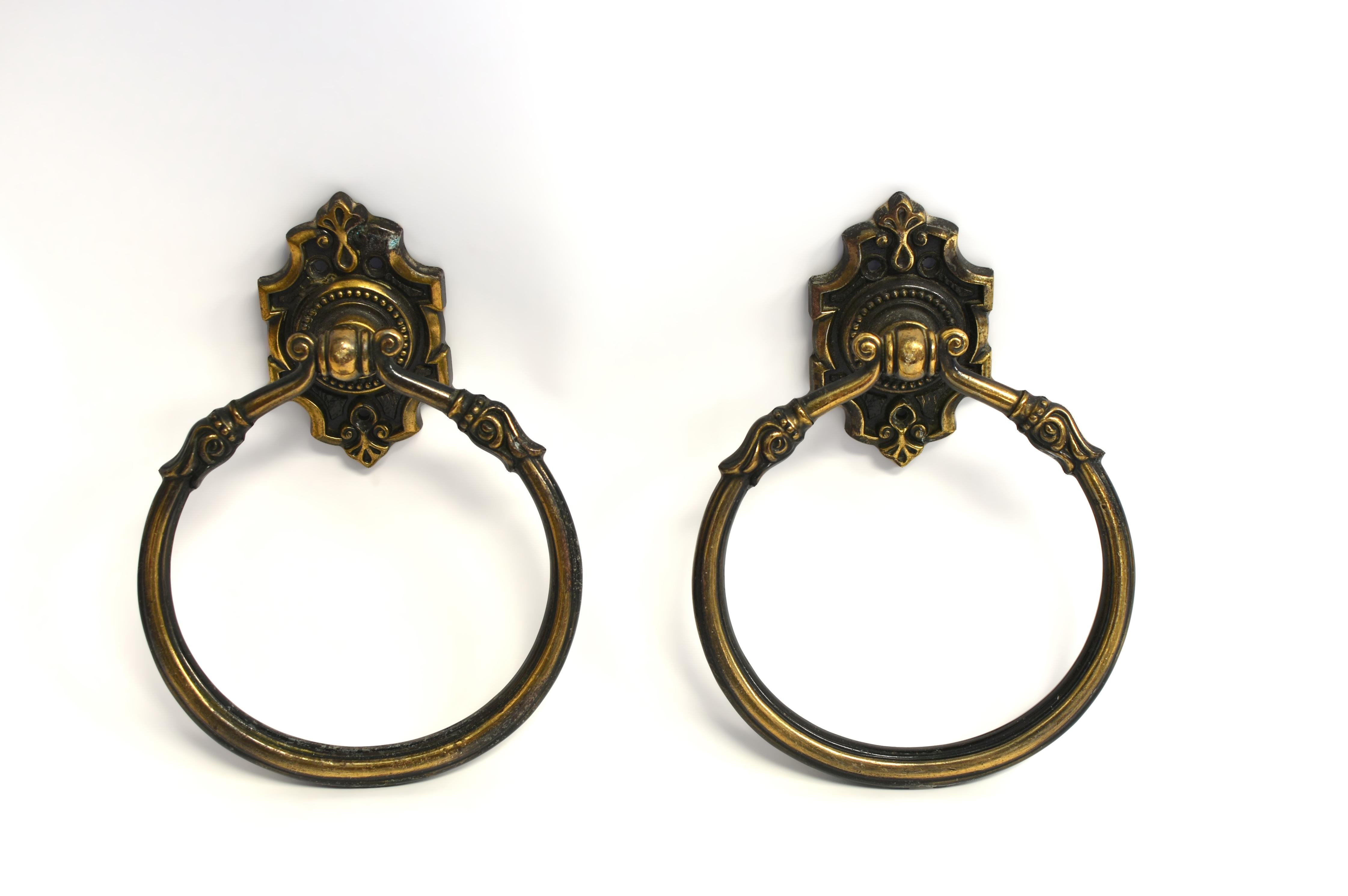 The large art nouveau style rings with elegant tulips, surmounted by symmetrical knobs, mounted on a chamfered plate with beaded medallions and florals. These beautiful pieces can be used on doors as handles, perhaps not as knockers since they are