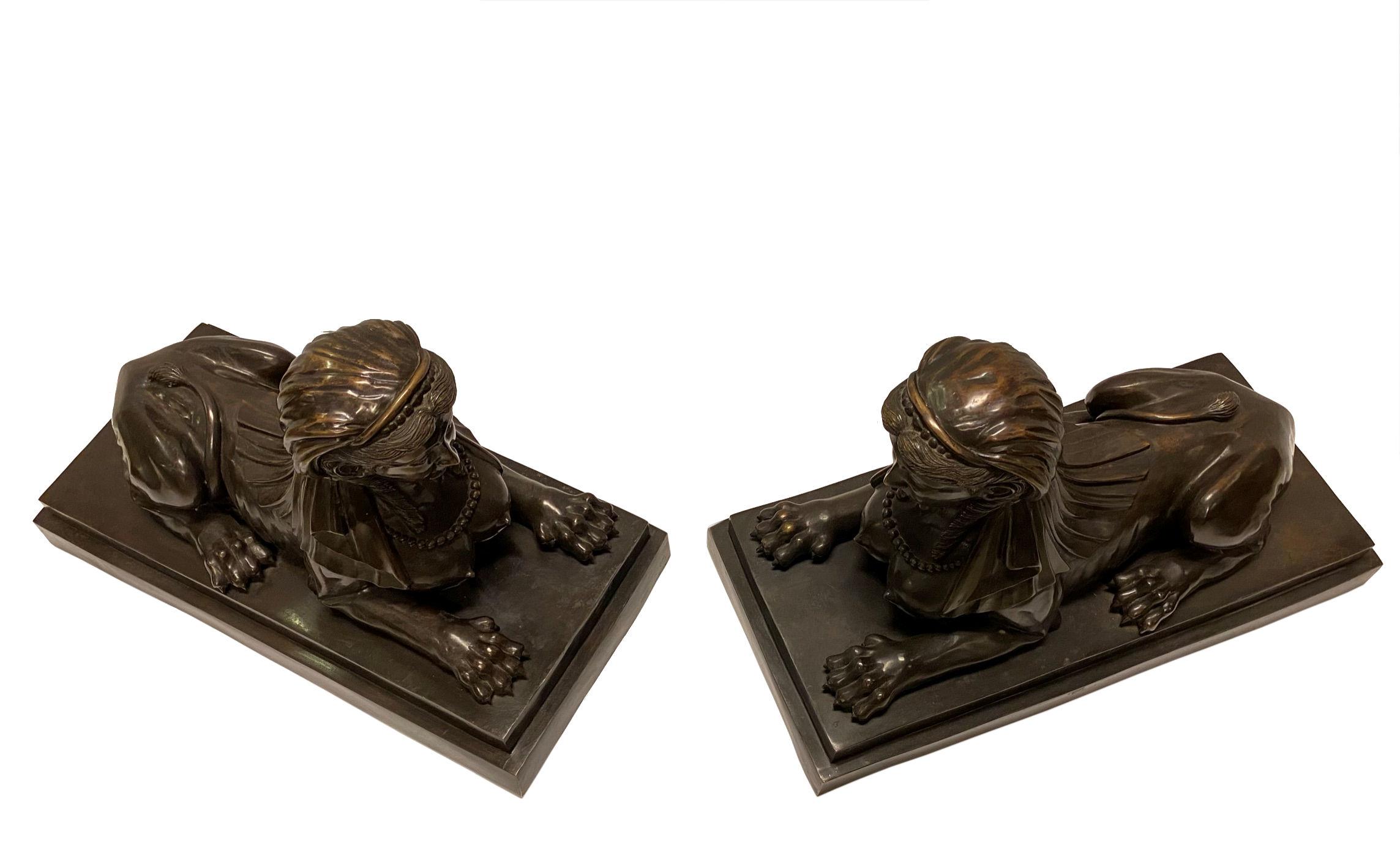 Pair of large French midcentury bronze Egyptian Sphinx sculptures.