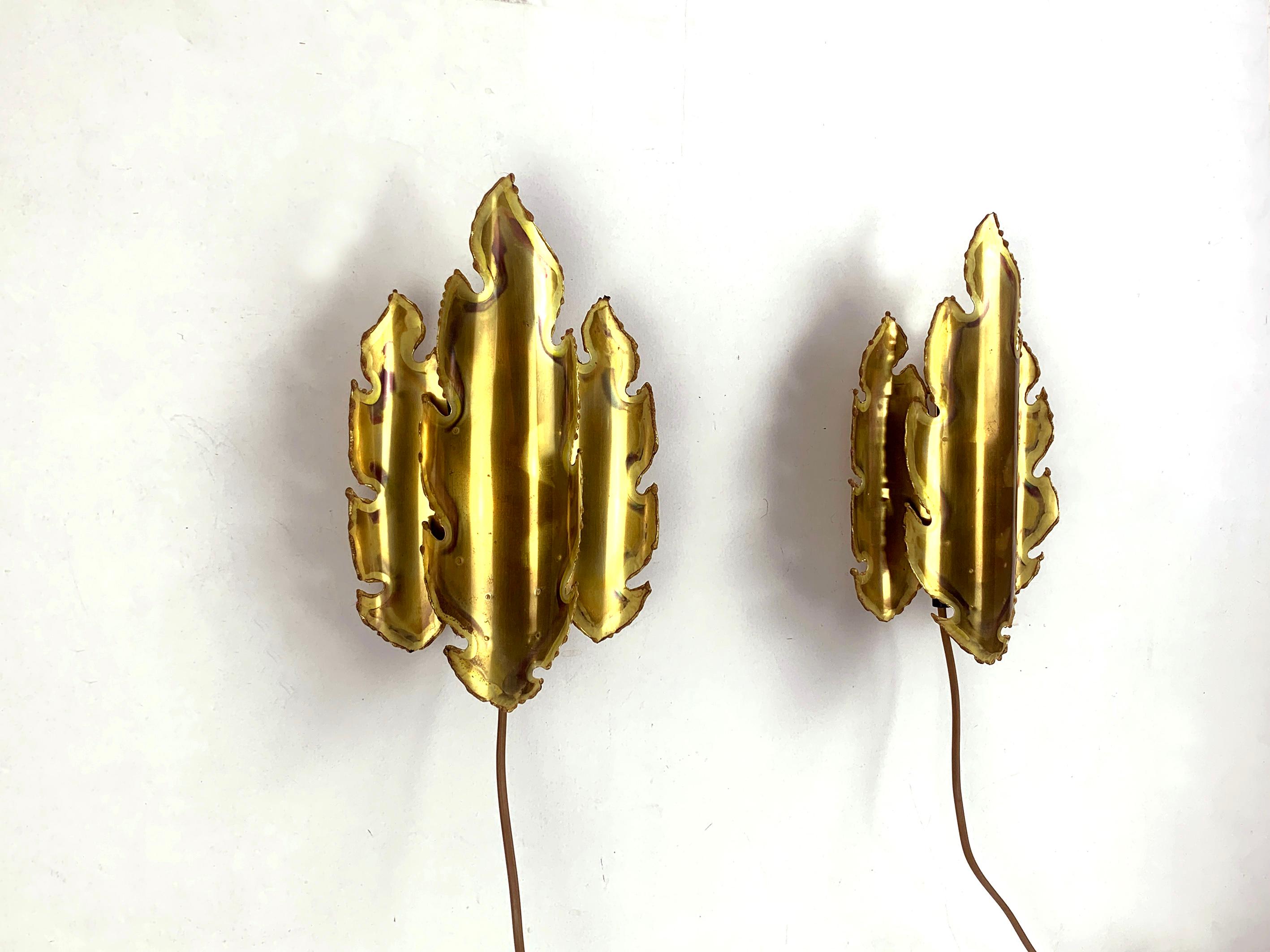 Vintage Sconces in Brutalist Style, labelled. 
Design by Svend Aage Holm Sørensen, for Holm Sørensen, Denmark. 
Made of Brass, Acid Tainted and Cut by Hand.

Svend Aage Holm Sørensen (1913-2004) was a danish designer. He is known for his