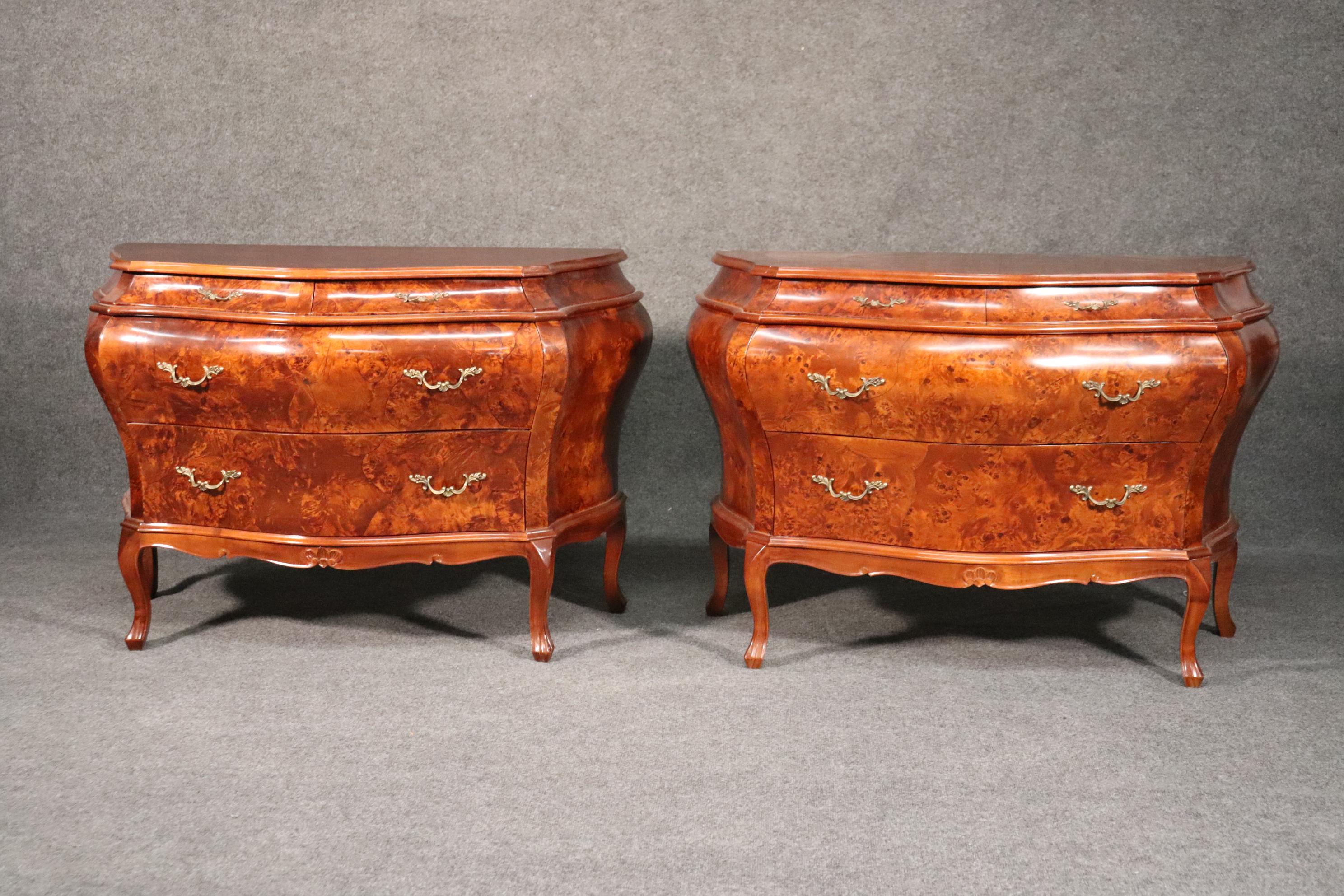 This is a beautiful pair of burled walnut Italian made commodes. Labeled made in Italy these commodes are designed in the bombe style and measures 29 inches tall x 45 inches wide x 19 inches deep. They date to the 1960s and are in good used