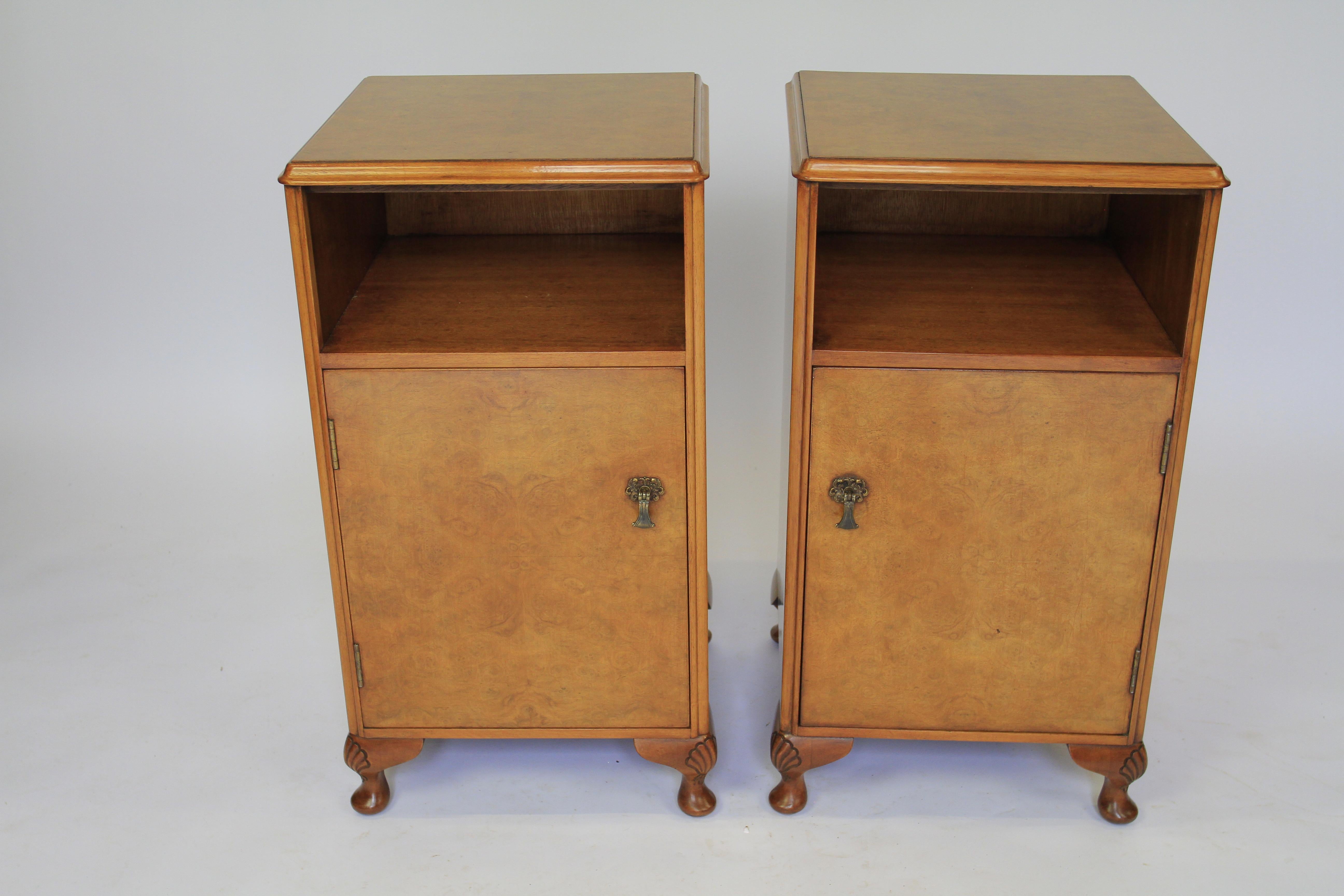 Pair Burr Walnut Bedside Cupboards circa 1930s
Burr walnut veneer on tops & door fronts, 
Figured Walnut veneer on sides, 
Single door cupboards with open compartment on top
4 squat cabriole shaped feet with shell carving on knees
Recently Polished