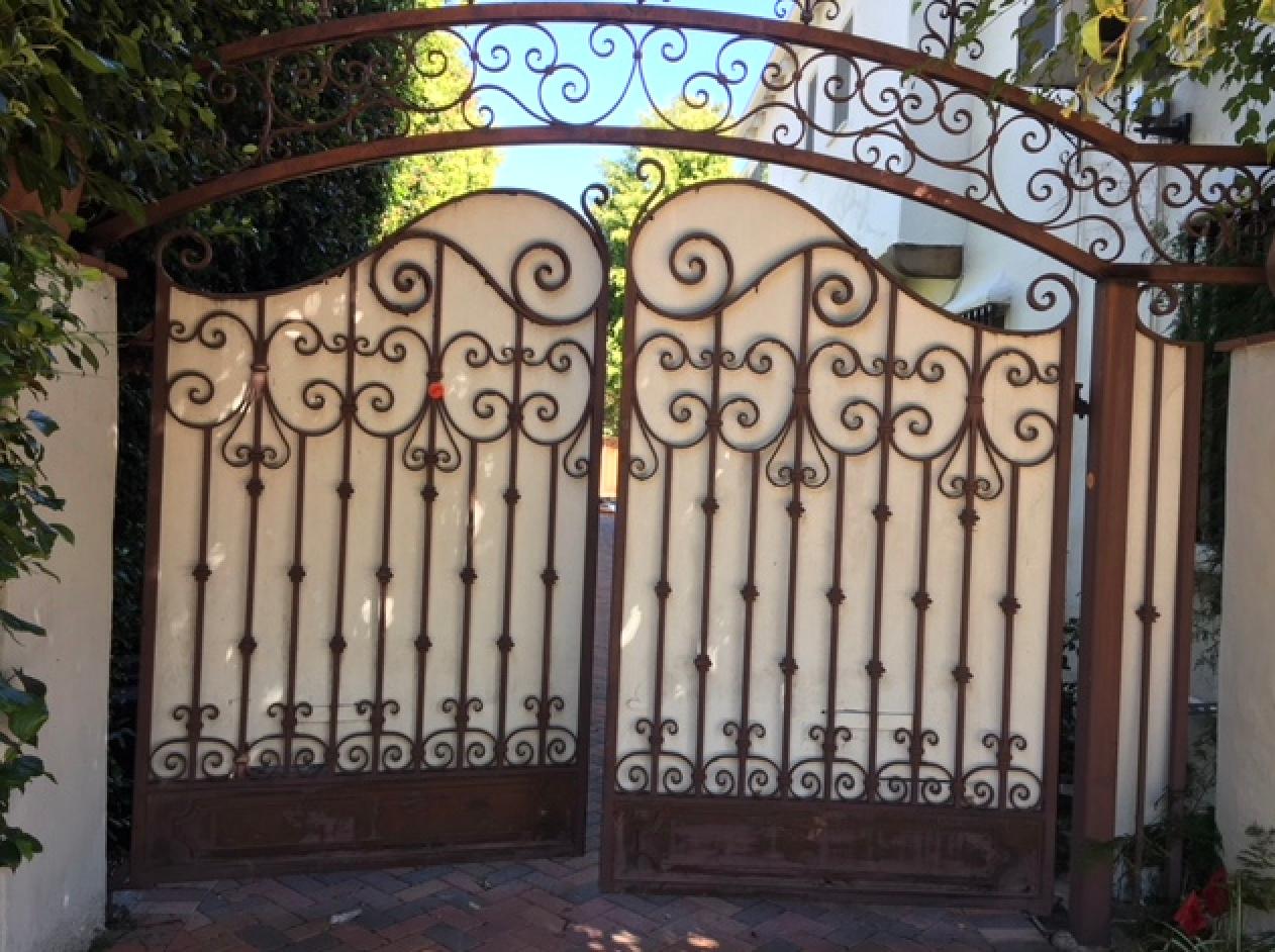 This is a great pair of custom made hand forged wrought iron driveway gates that came off a 1920's Spanish Hacienda in Beverly Hills that was demolished a couple of years ago - the same house that the spanish clay roof tiles came from (another