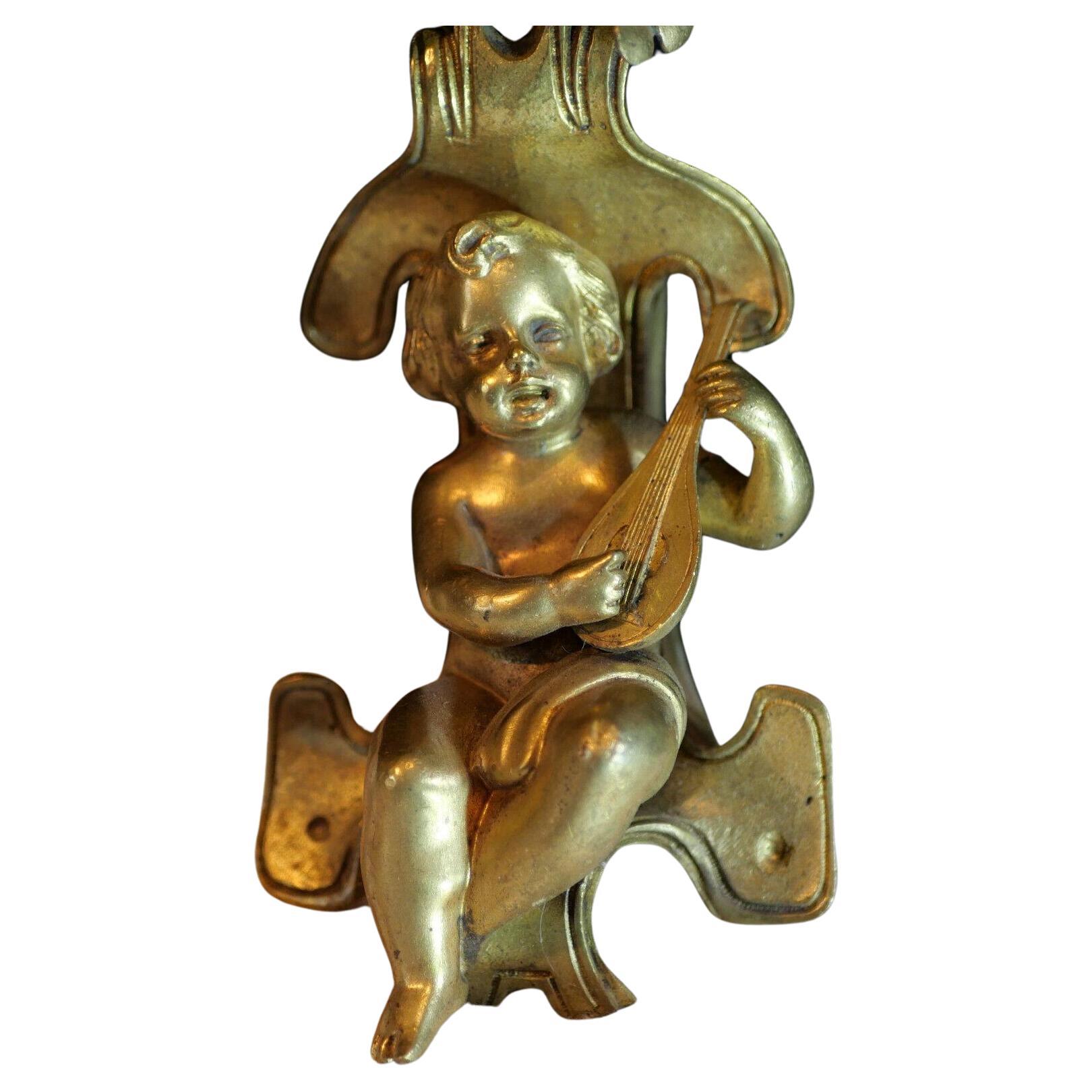 c1800 Pair French Louis XVI Rococo style Gilt Bronze Musical Cherubs. The Cherub sitting un the hovering foliage. Excellent detail, very high quality pair of Sconces. Original unelectrified state.