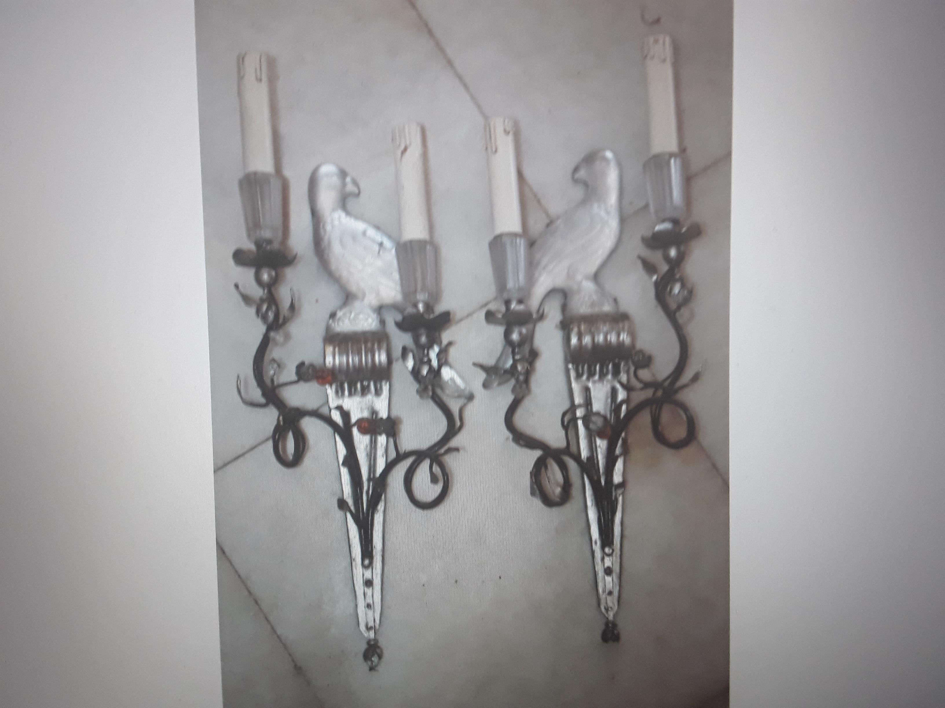 Pair French Hollywood Regency Frosted Crystal Parrot / Bird Wall Sconces by Maison Bagues Paris. One bird faces left and one bird fasinf left. Bronze metalwork.