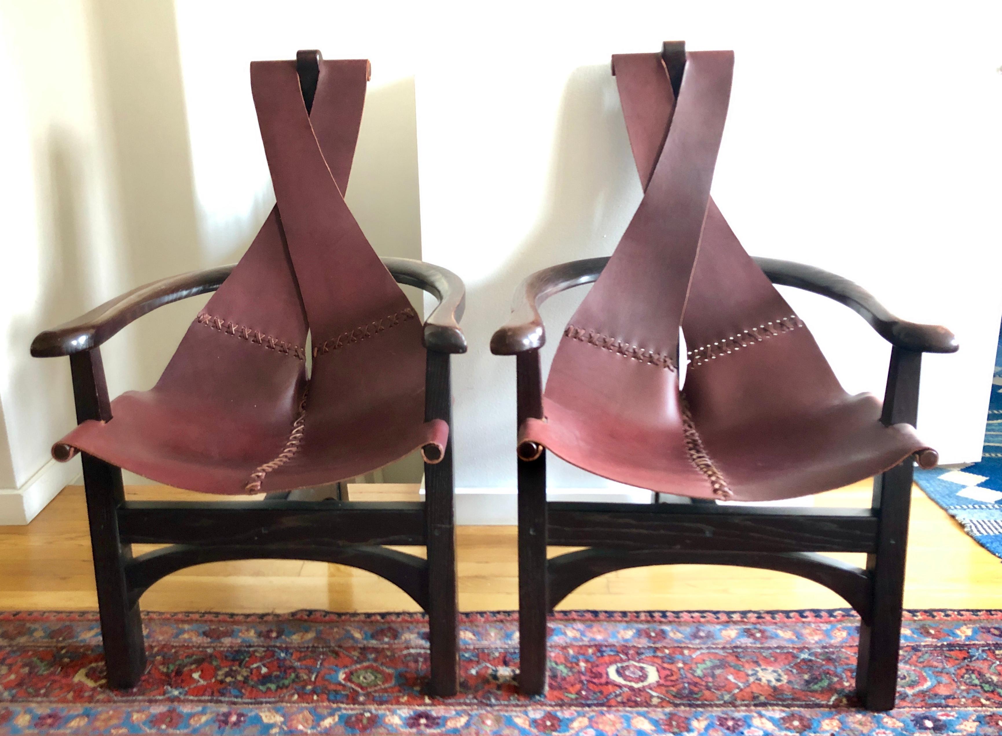 Great sculptural, organic-modern design. Solid hardwood frames with handstitched burgundy saddle leather sling. High quality wood peg construction. Unsigned.