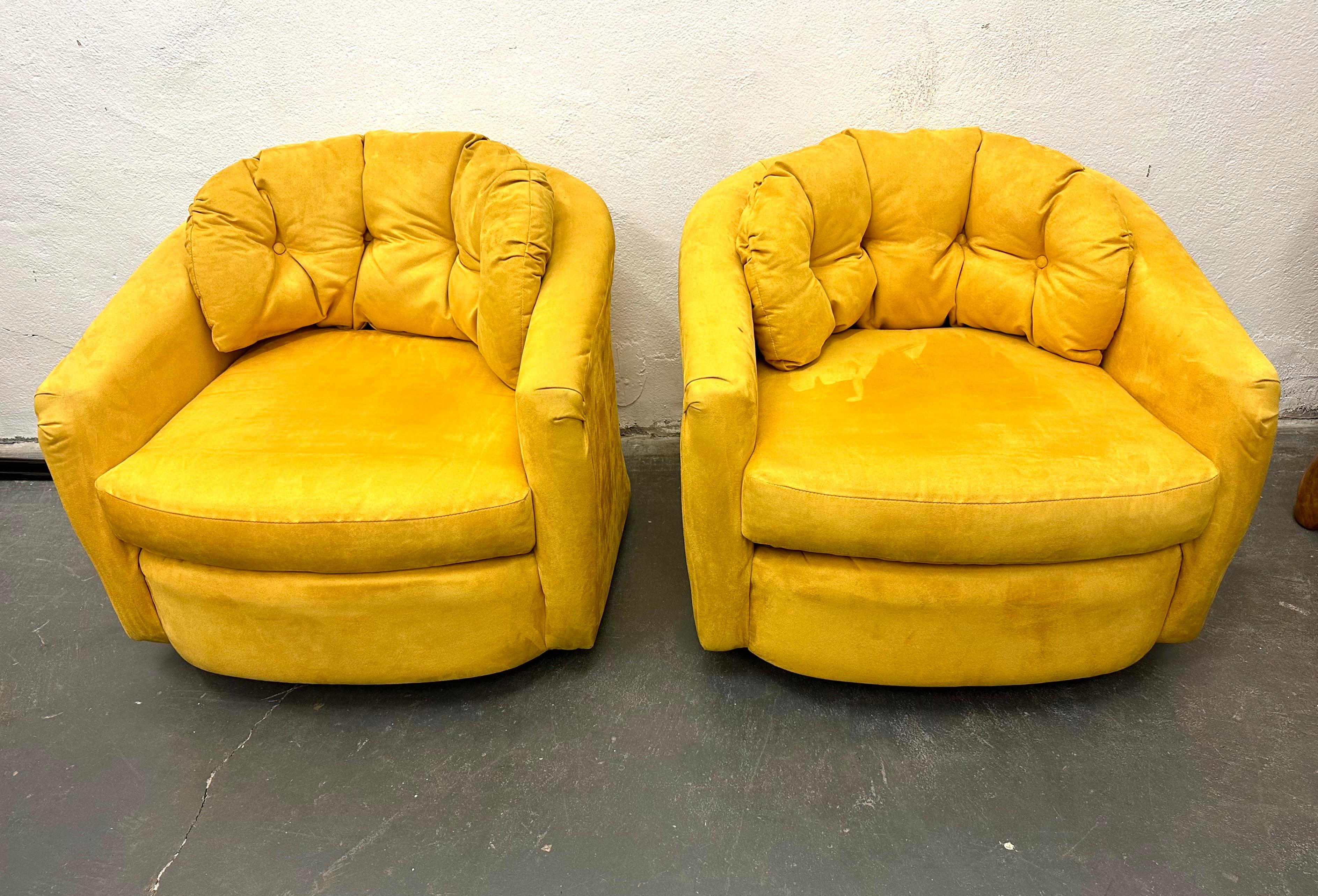 Fun Pop yellow suede tub chairs on swivel base.  The original upholstery in very clean with plush stuffing.  The seat and tufted back cushions are loose. Unlabeled but in the style of Milo Baughman