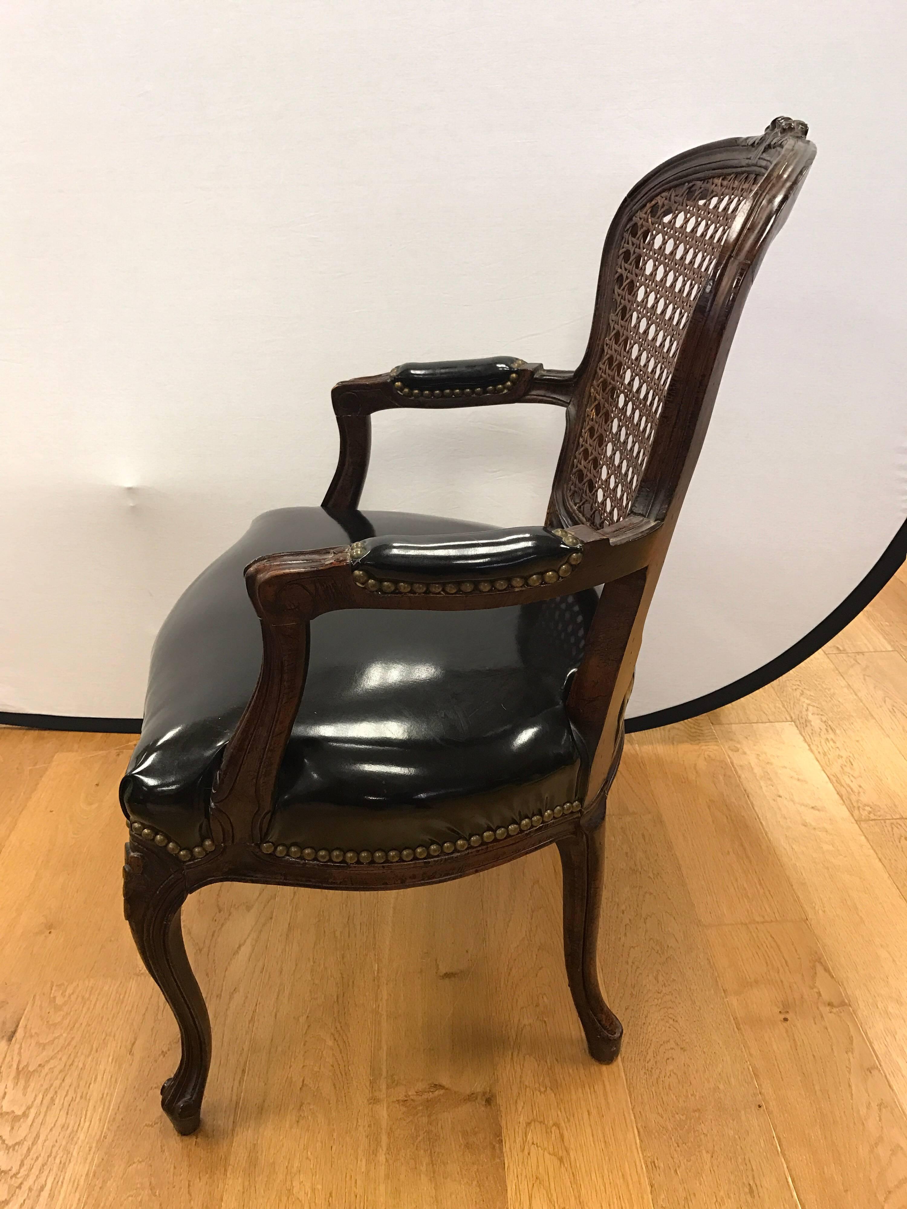 Pair of Cane Back French Louis XV Carved Chairs with Black Patent Leather Seats In Excellent Condition In West Hartford, CT