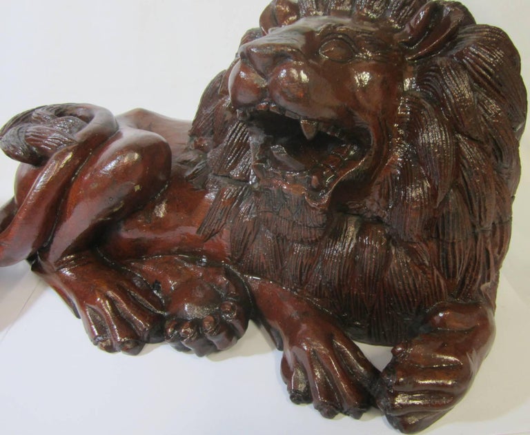 Pair of Carved Hard Wood African Lions For Sale at 1stDibs