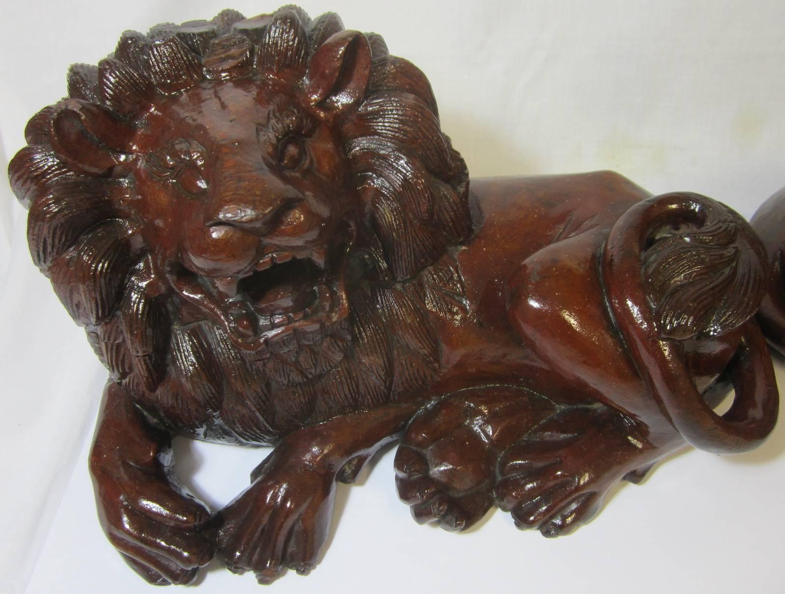 Late 20th Century Pair of Carved Hard Wood African Lions For Sale