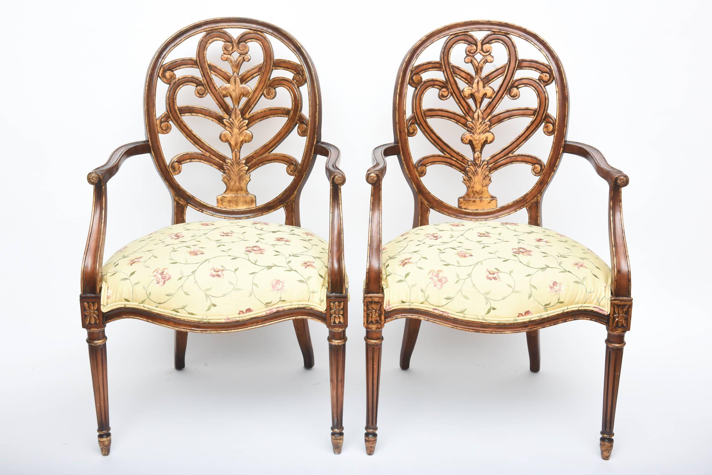A great pair of armchairs that have been recently upholstered in a yellow ground floral needlepoint design. Very nice antique condition and hopefully the pictures will capture the grace and elegance in the design. The seat at its widest point