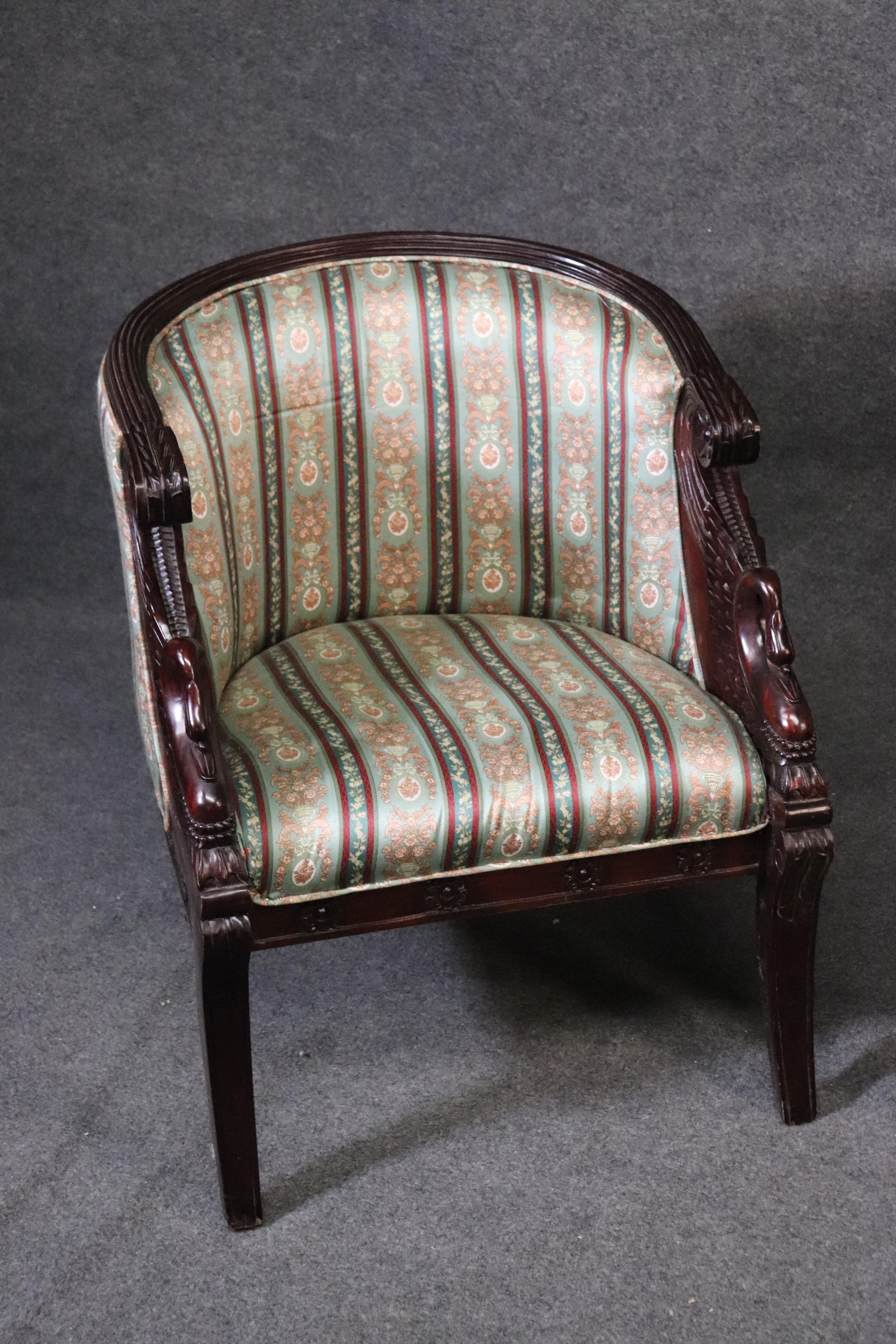 These are beautiful swan carved club chairs with wonderful design elements and a great looks. They are in good used condition and date to the 1950s era. They each measures 33 inches tall x 26 inches wide x 23 inches deep x seat height of 18 inches.