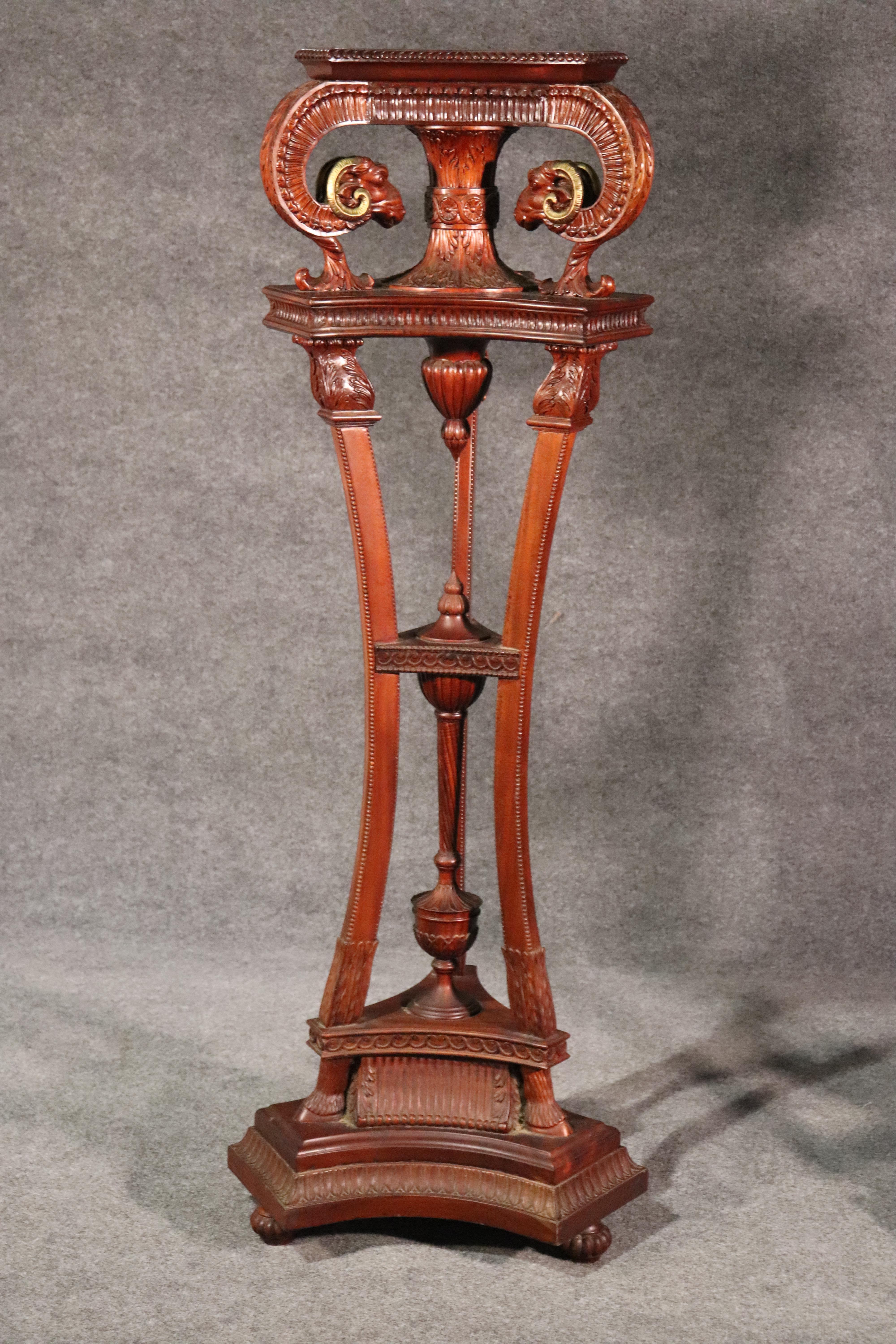 This is a pair of outstanding carved mahogany pedestals. They have fantastic carving and detail and subtle gilded details. They date to the 1950s and are in good condition.
Measures: 57 tall x 18 x 18 at the widest points and 14 x 14 at the top.