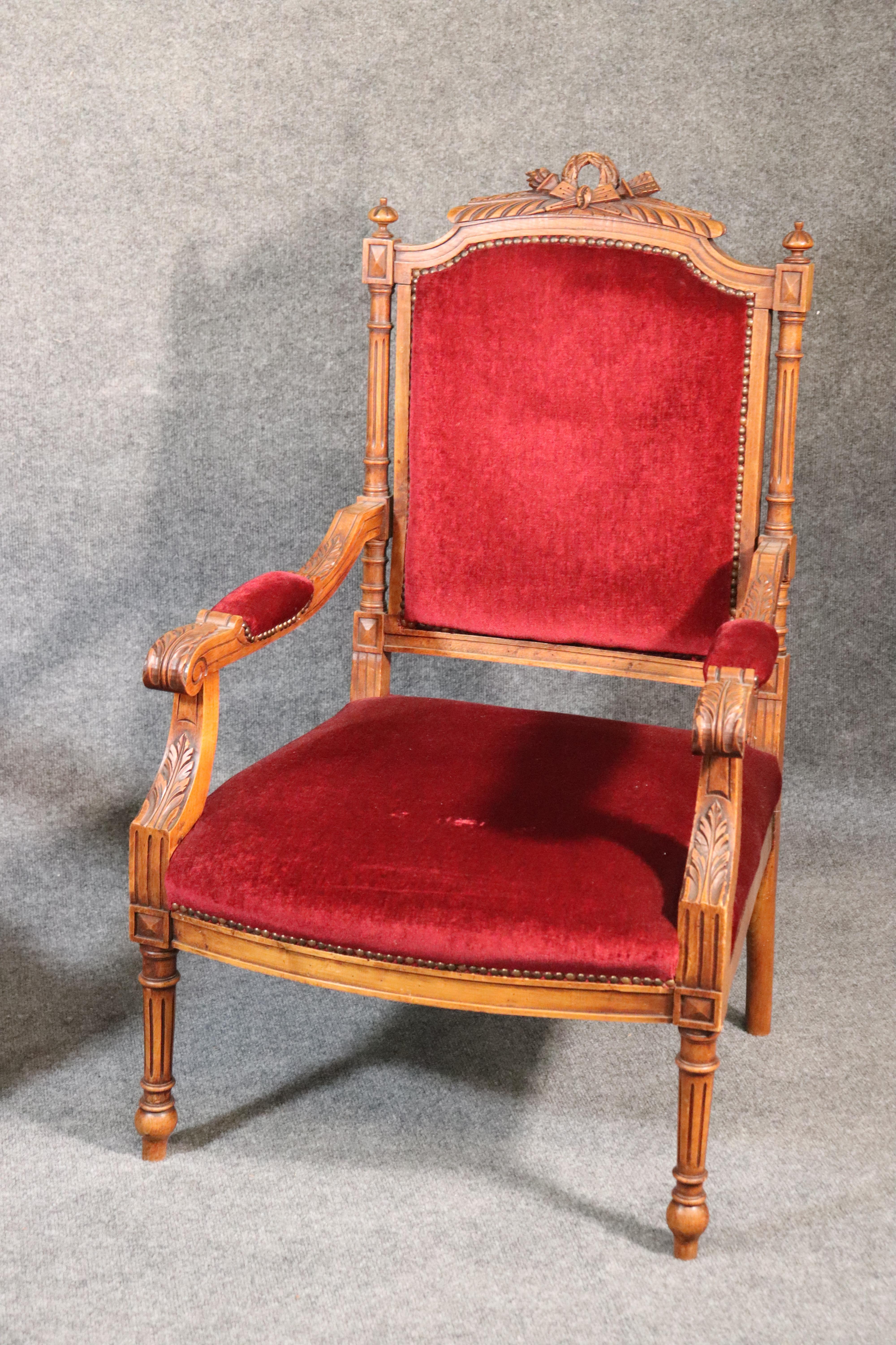 French Pair of Carved Walnut Burgundy Velvet Louis XVI Fauteuil Armchairs, circa 1920