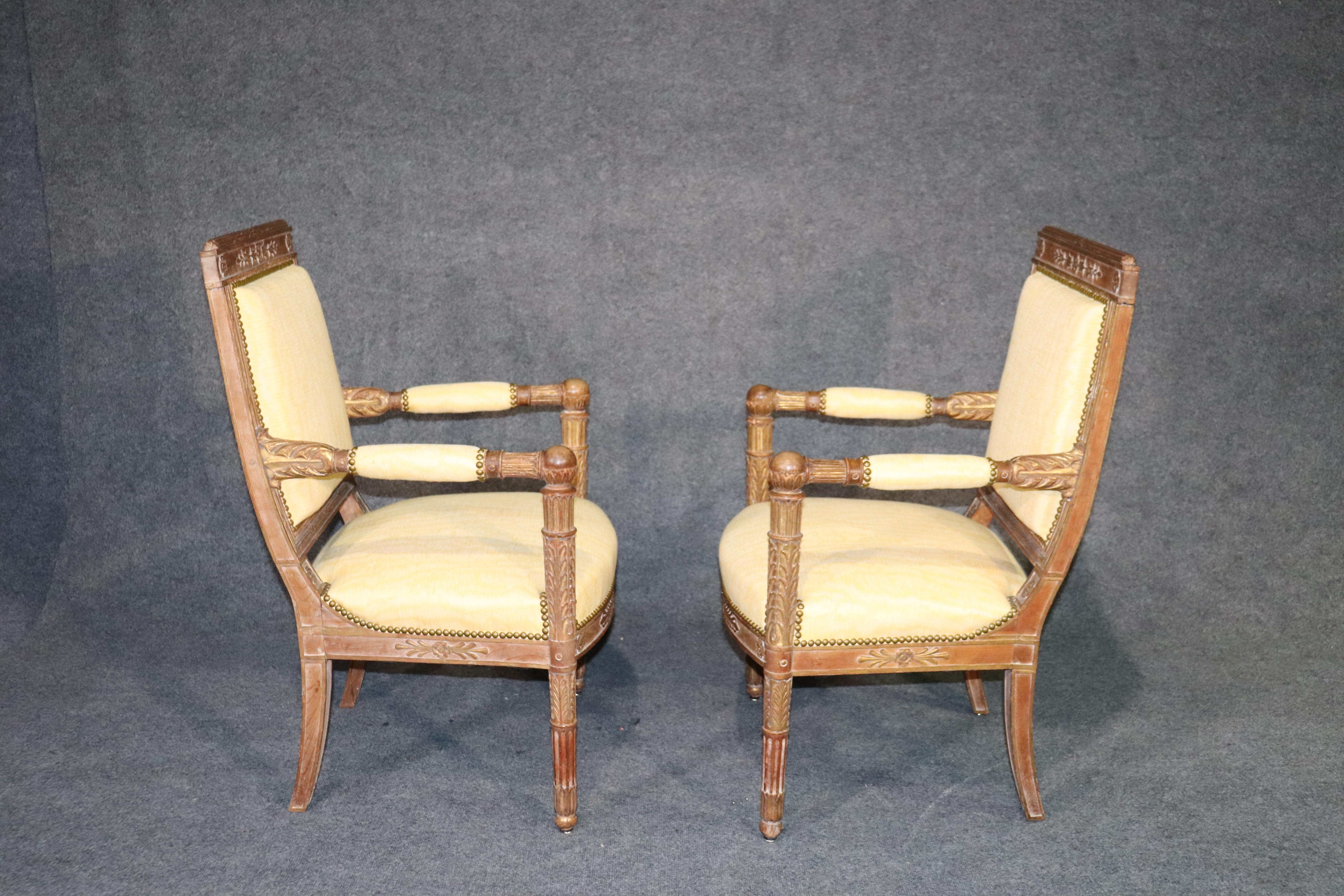 This is a spectacular pair of finely carved French Empire style fauteuils. The chairs have a fantastic finish, unbelievable carving and are in ready to go condition. They are the perfect accent chairs for your current project. The chairs date to the