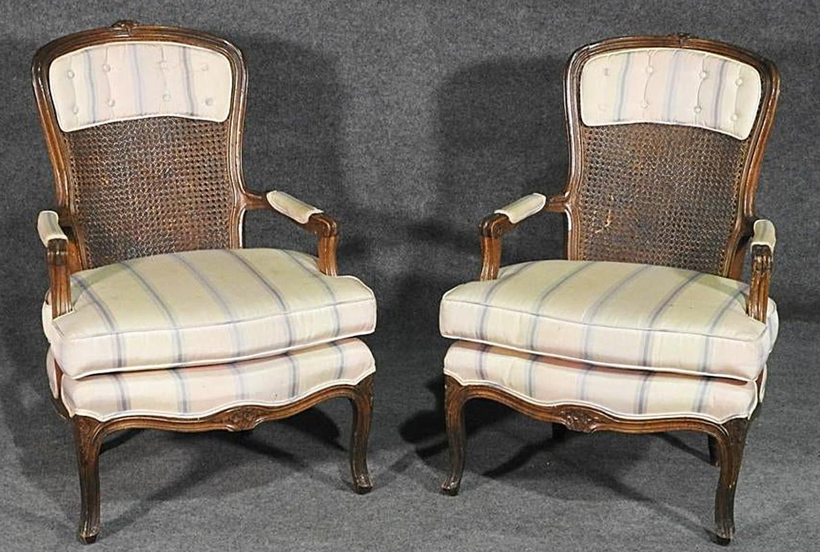 Mid-20th Century Pair of Carved Walnut French Louis XV Cane Back Upholstered Armchairs circa 1950