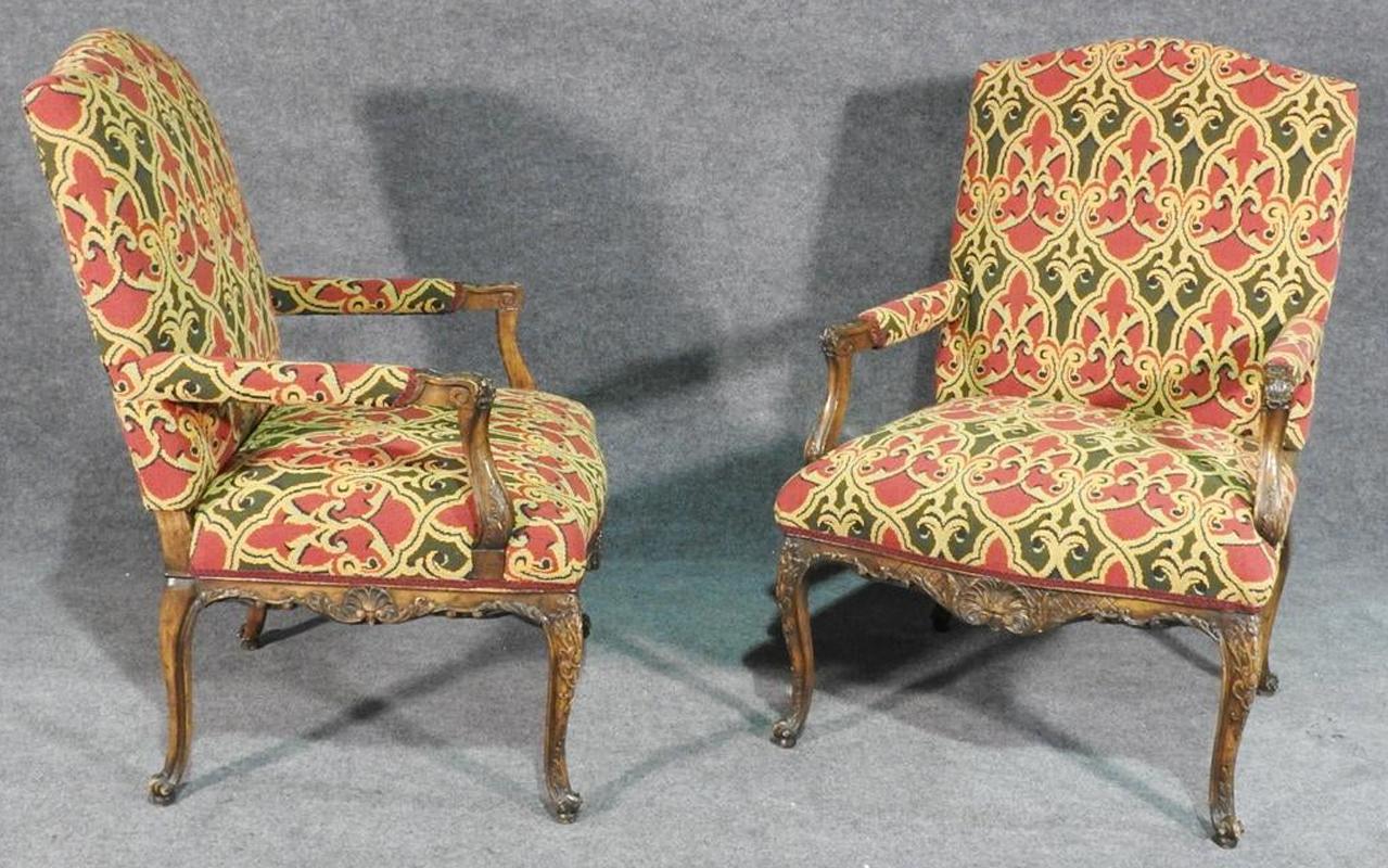 First this is a very high quality tapestry upholstery with some of the nicest frames I have seen in a long time. The chairs are in very good vintage condition and date to the 1950s era. They each measure 42 1/4