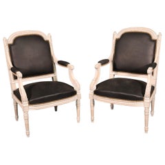 Pair Carved White Paint Decorated French Louis XVI Style Armchairs with Leather