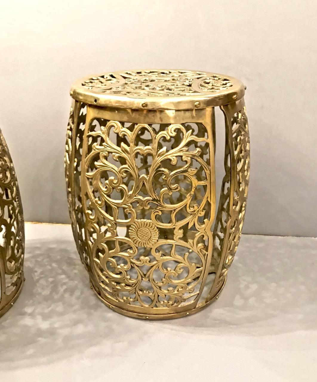 Great pair of cast brass stools with the casting in the form of scrolling vines and central floral motif. These stools are a bit taller than the standard garden seat height. They are true standouts.
 