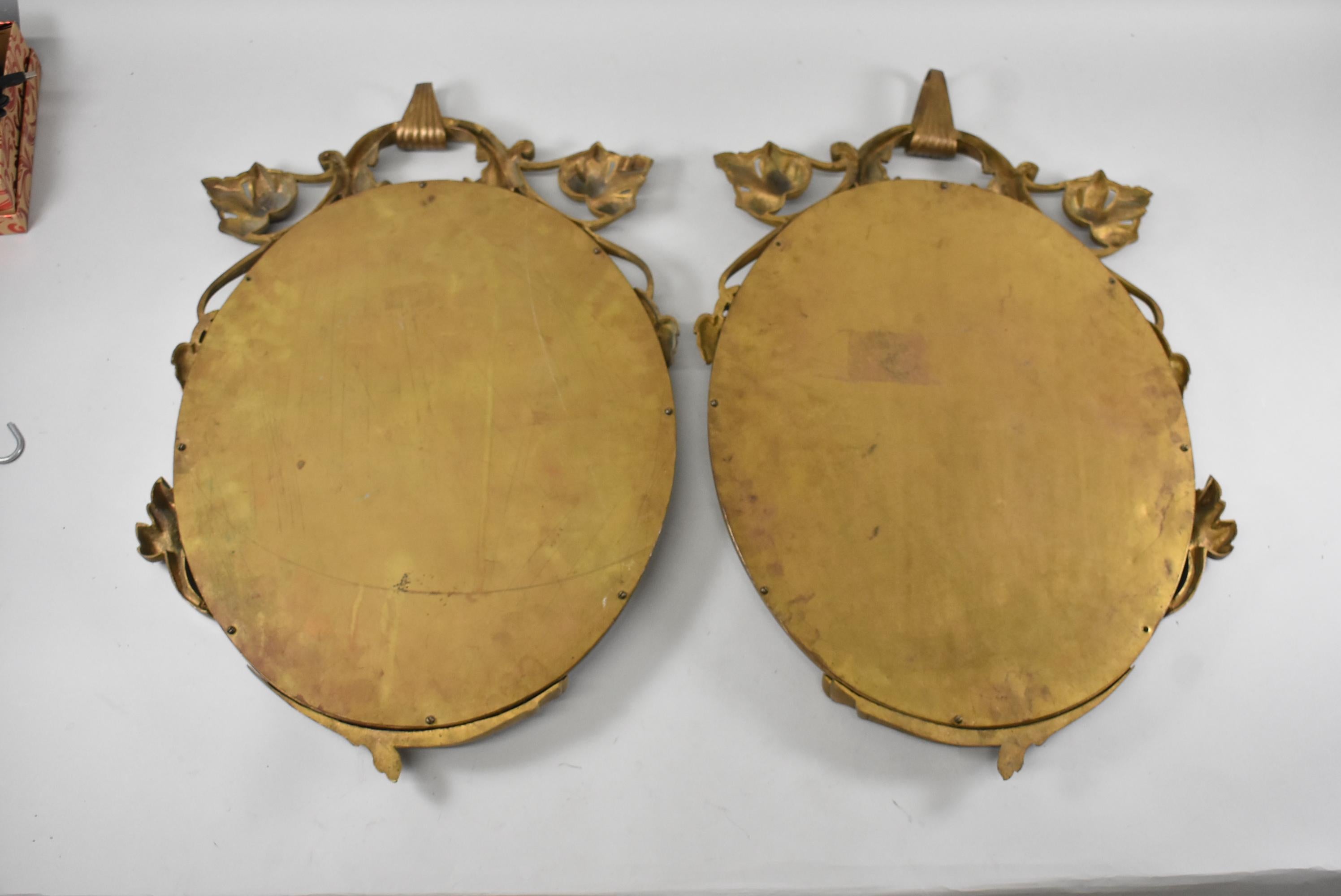 Pair of Cast Bronze Oval Wall Mirrors Scrolled Leaf Details In Good Condition In Toledo, OH