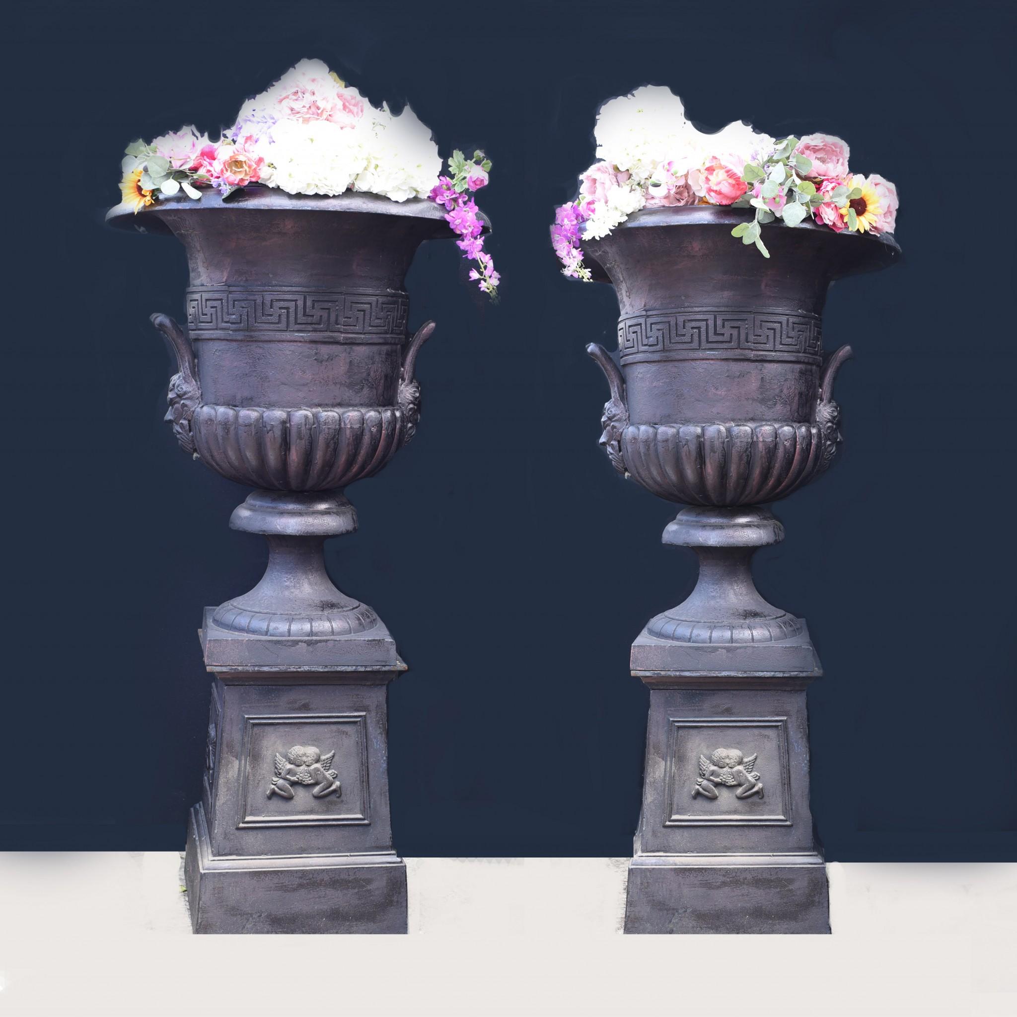 - Eye catching pair of large cast iron garden urns
- Classically inspired with campana form and standing on the pedestal base
- stand in at almost seven feet tall - 205 cm
- Perfect for the garden, look great overflowing with foliage and vines
-