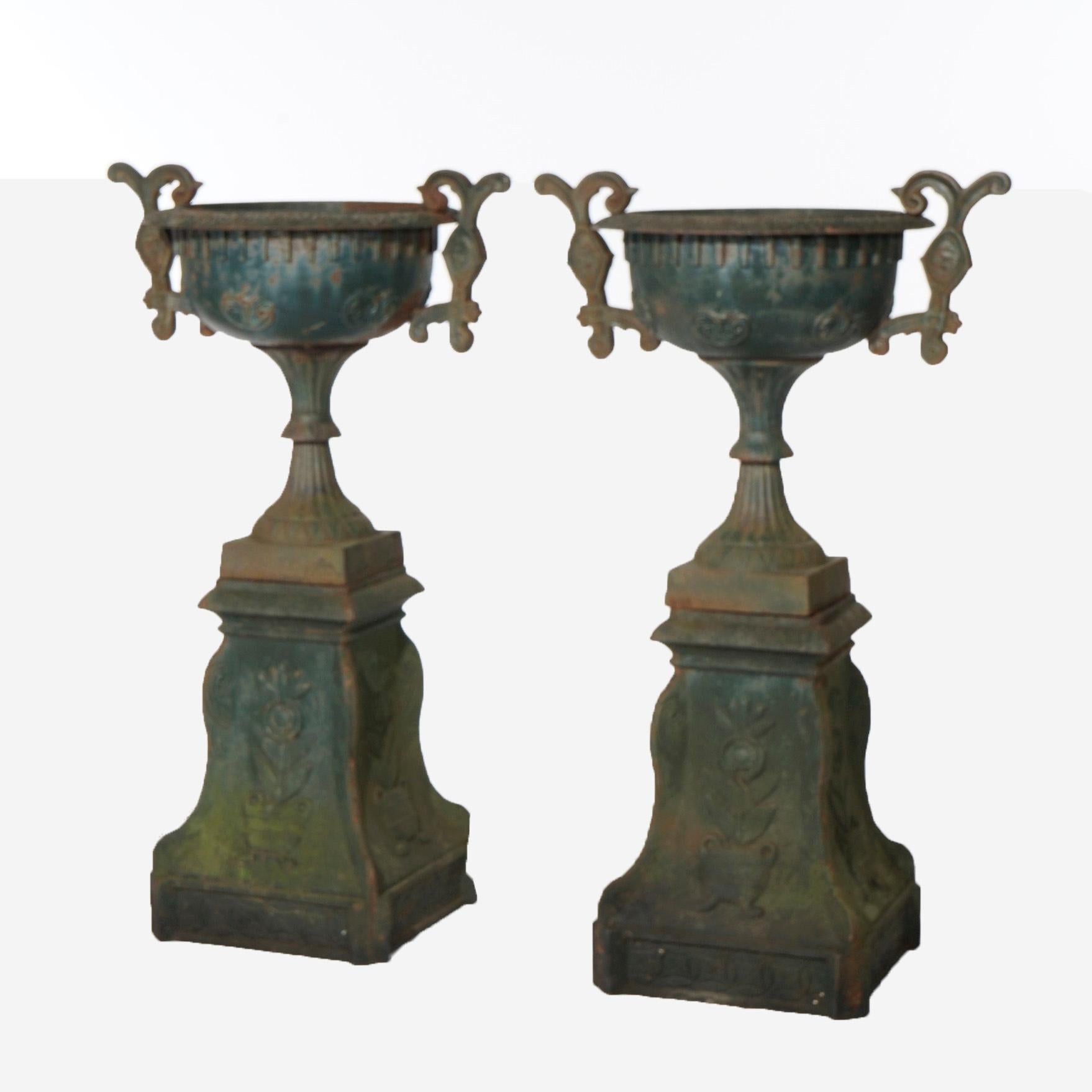 Classical Greek Pair Cast Iron Handled Grecian Urns on Floral Embossed Plinths 20th C