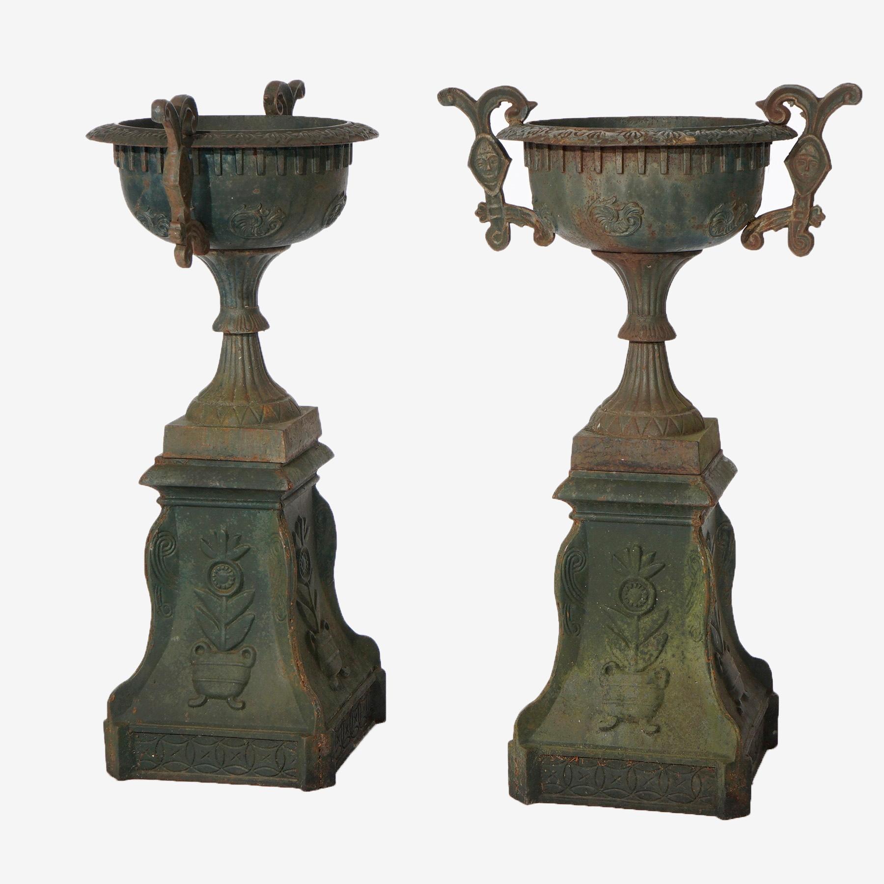 Pair Cast Iron Handled Grecian Urns on Floral Embossed Plinths 20th C In Good Condition In Big Flats, NY