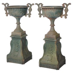 Vintage Pair Cast Iron Handled Grecian Urns on Floral Embossed Plinths 20th C