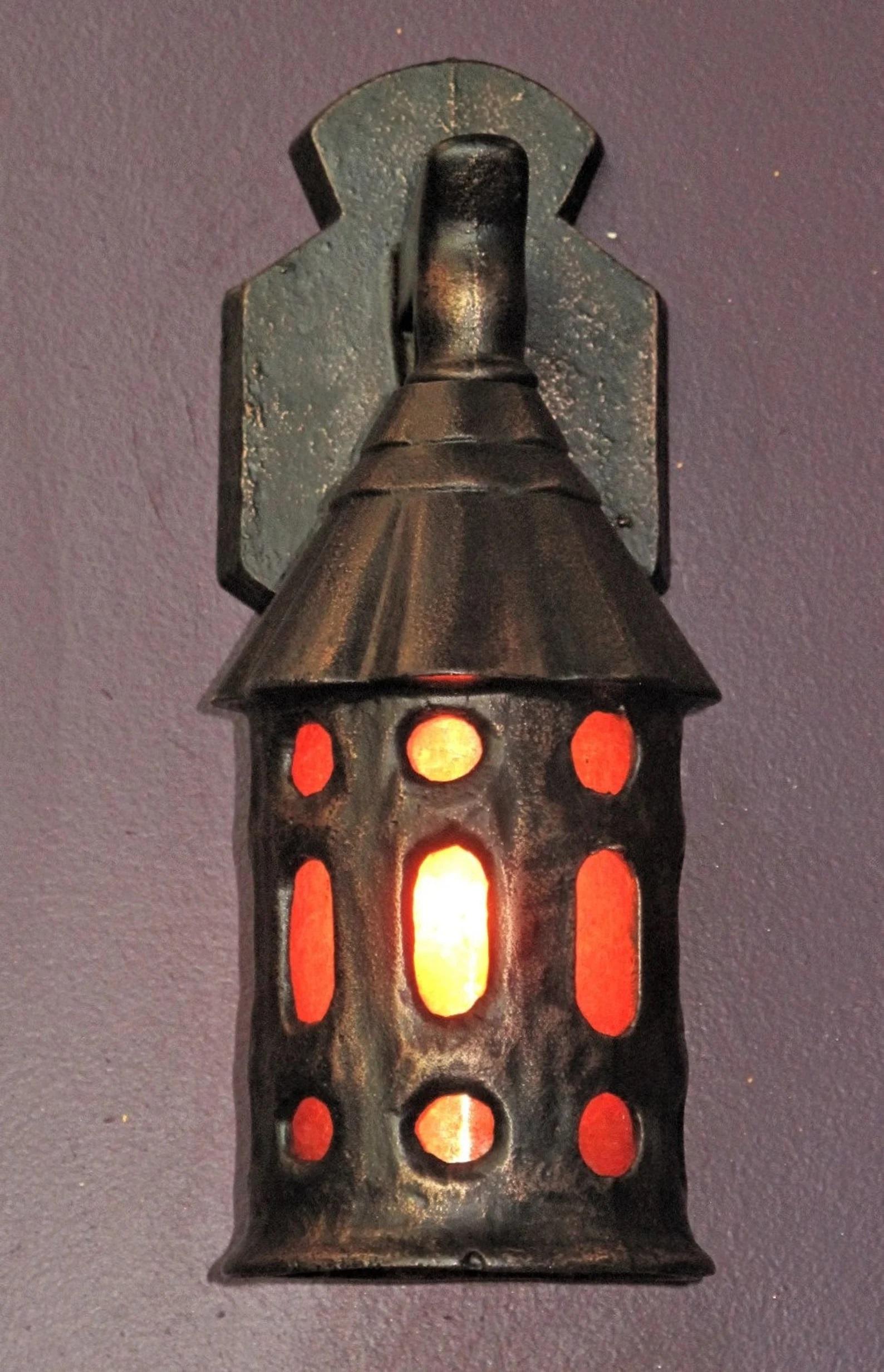 Priced for the pair.
Circa 1920 cast iron porch lights with mica insert shade. Refinished in an oil rubbed bronze color which really is a great compliment to the amber mica. You really need to see these with the lights on to grasp the wonderful glow