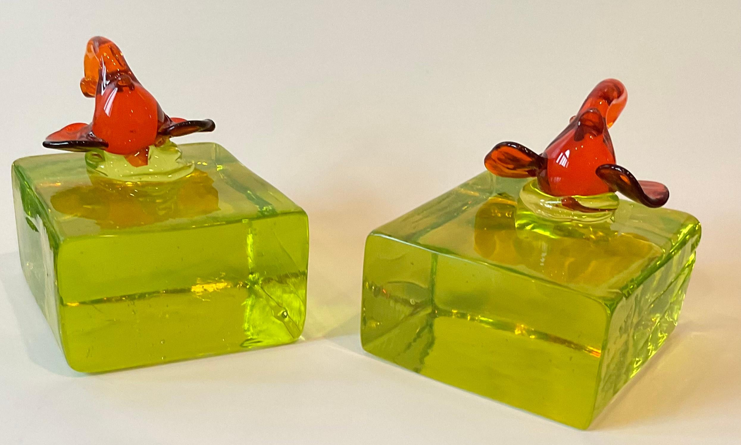 Amazing pair of Murano bookends by Cenedese circa 1950’s. Bookends retain an original label dating them to the 1950’s. Thick Vaseline glass with applied elephants. 

At the end of World War II, in 1946, after being tutored by various glass