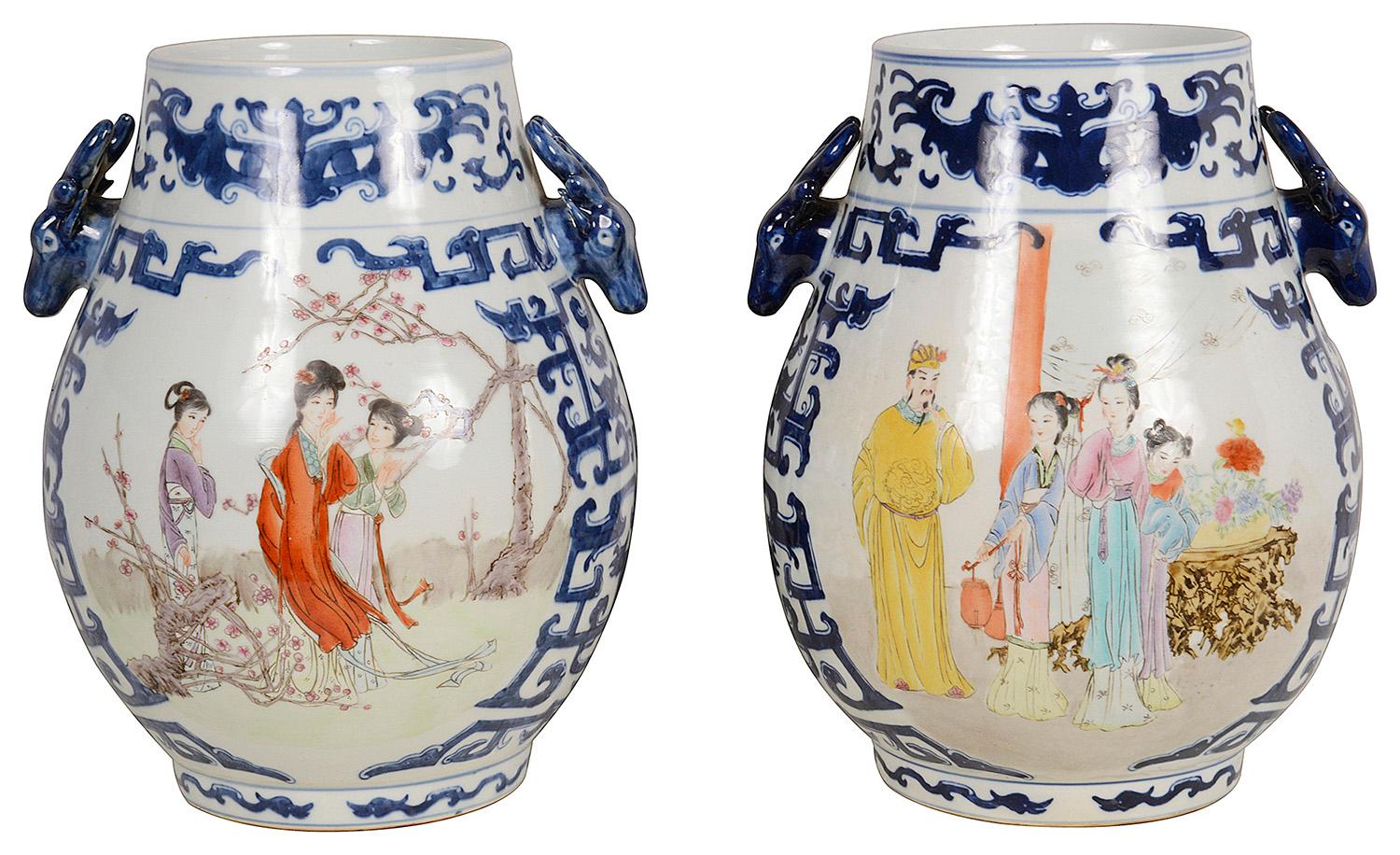 A very decorative pair of 20th Century Chinese porcelain vases / lamps.
Each with blue coloured classical motif decoration boarders and Deer head handles, inset hand painted panels depicting females in attendants among flowers and
