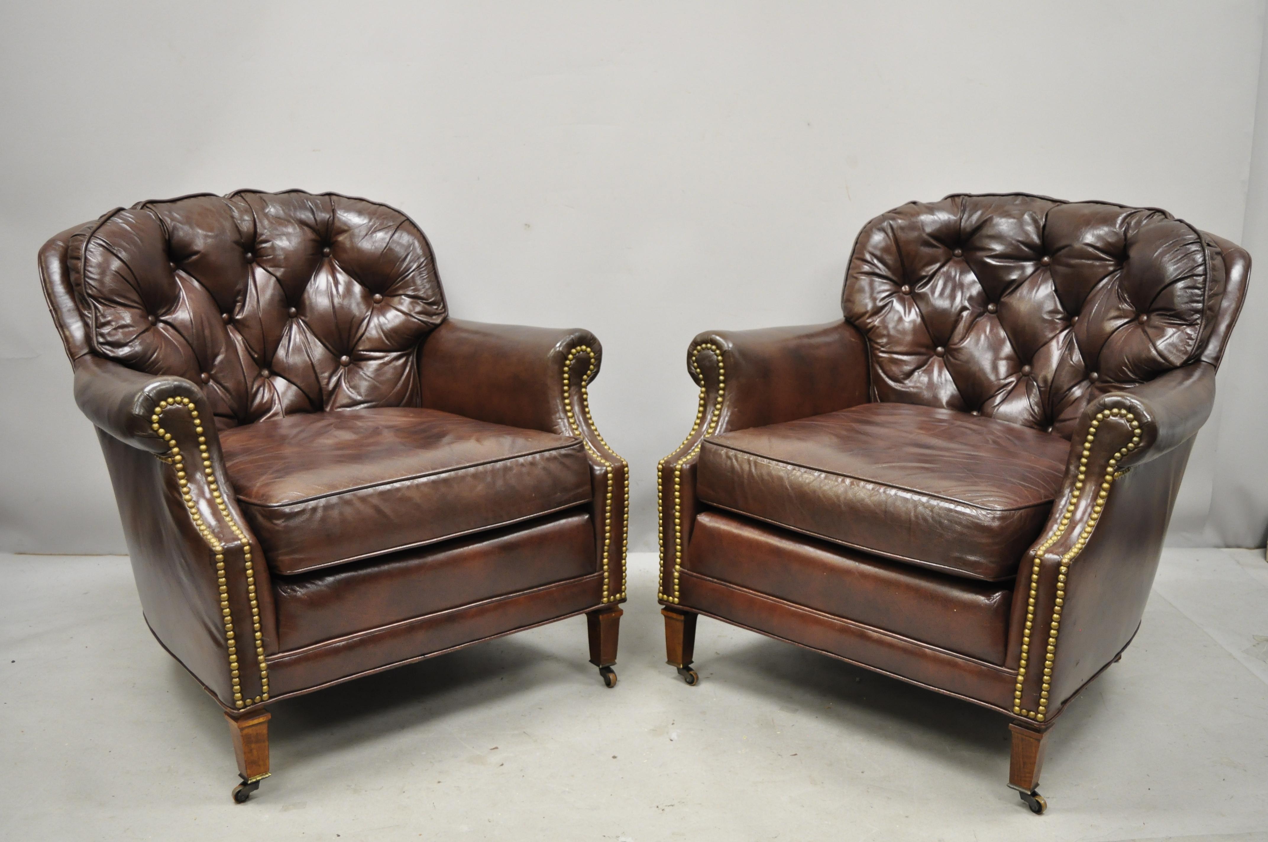 Pair of Century Furniture Co. brown leather chesterfield club lounge chairs and ottomans. Listing features (2) club chairs, (2) ottomans, rolling casters, button tufted leather upholstery, original label, quality American craftsmanship, great style