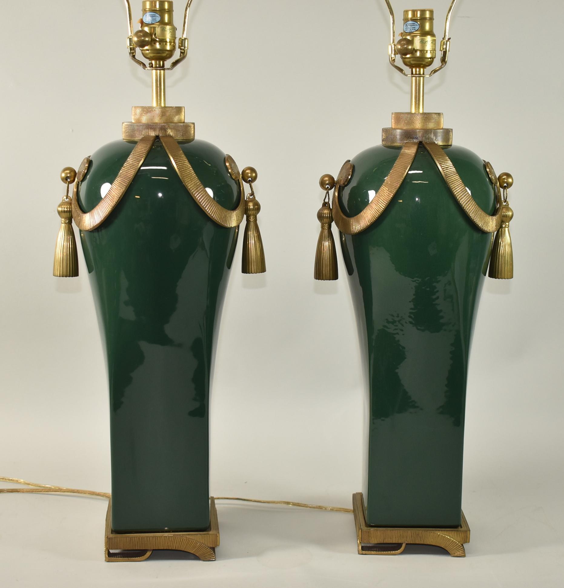 Pair of brass and dark green ceramic single socket table lamps. Large round brass knob, and brass detailing. Dimmable switch. With shade 36