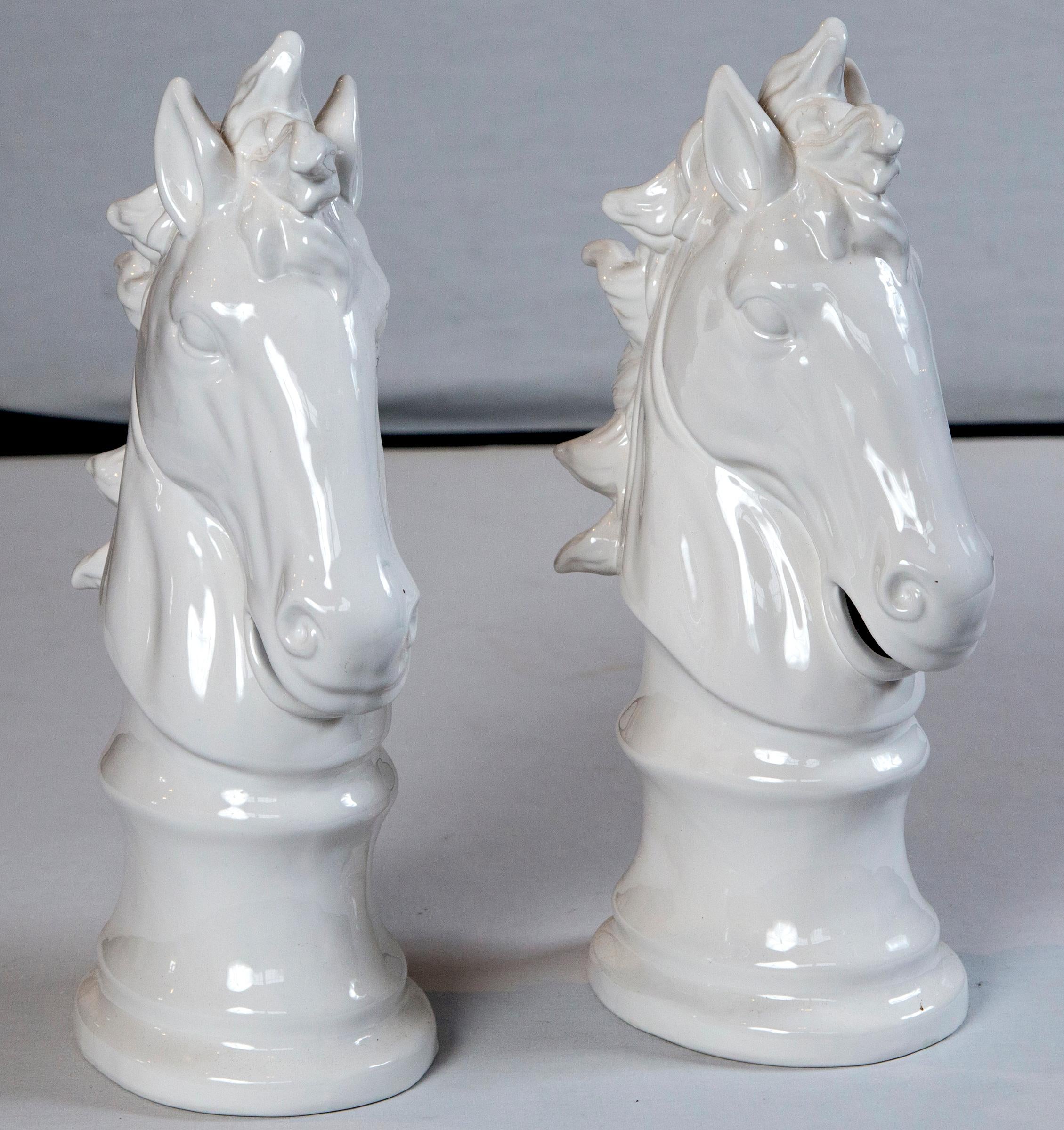 Pair of animated white ceramic horse heads. Unmarked.