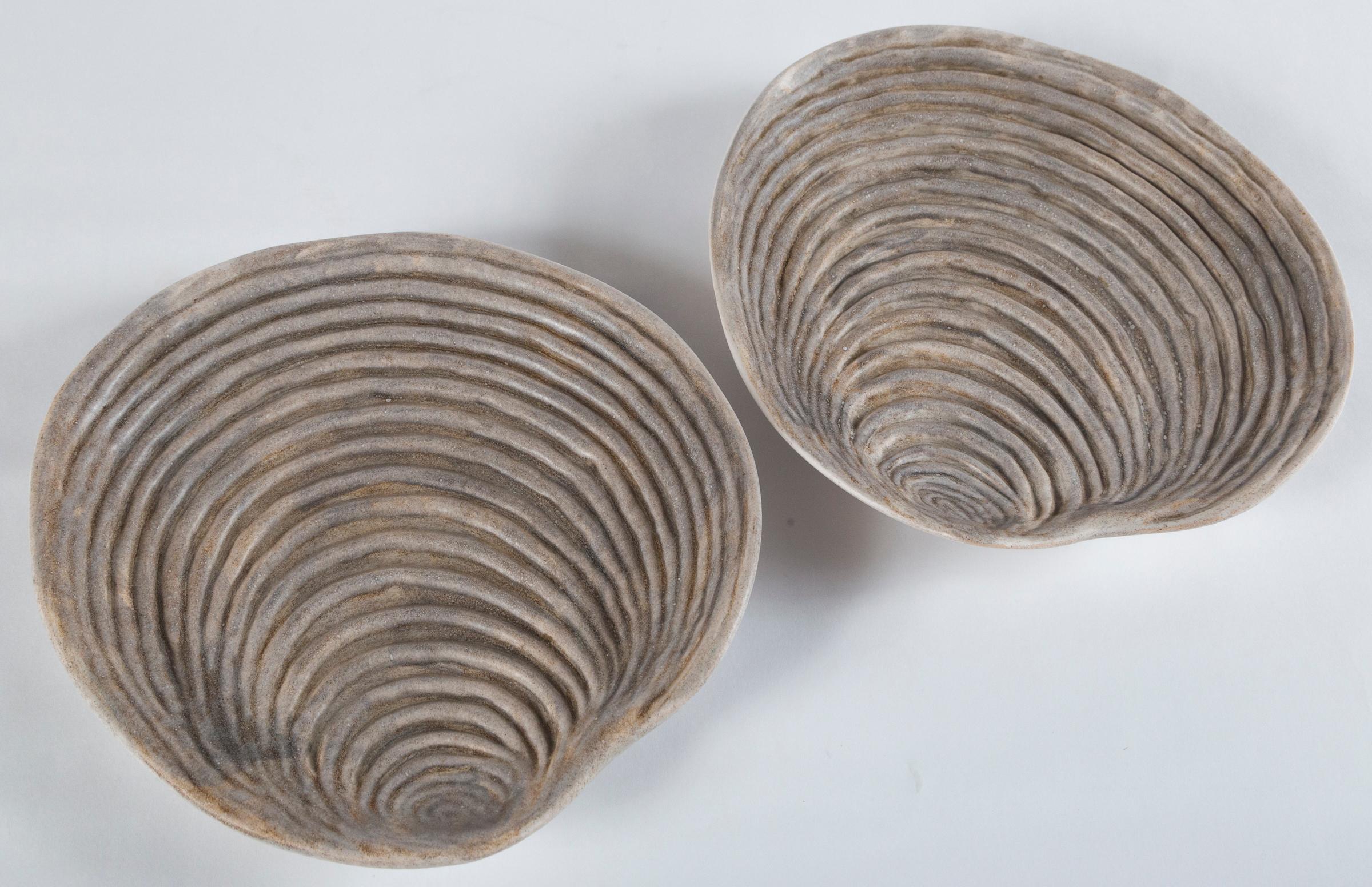 Pair of ceramic oyster shell plates, Marcel Guillot, France, circa 1950s. Marcel Guillot (1910-1985) was a prominent ceramic artist with a studio in Paris, known to incorporate unusual glazes and forms.