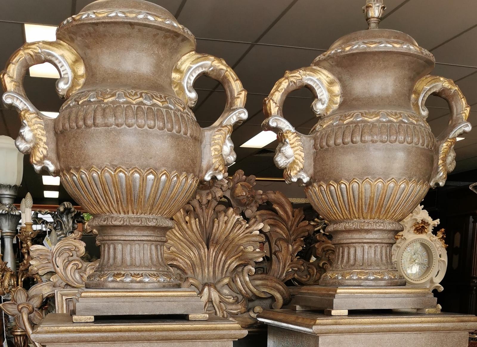Pair of painted wooden pedestals with ceramic urns,
total height 210cm,
pedestals 43 x 138cm high,
urns 35 x 59 x 73cm high.