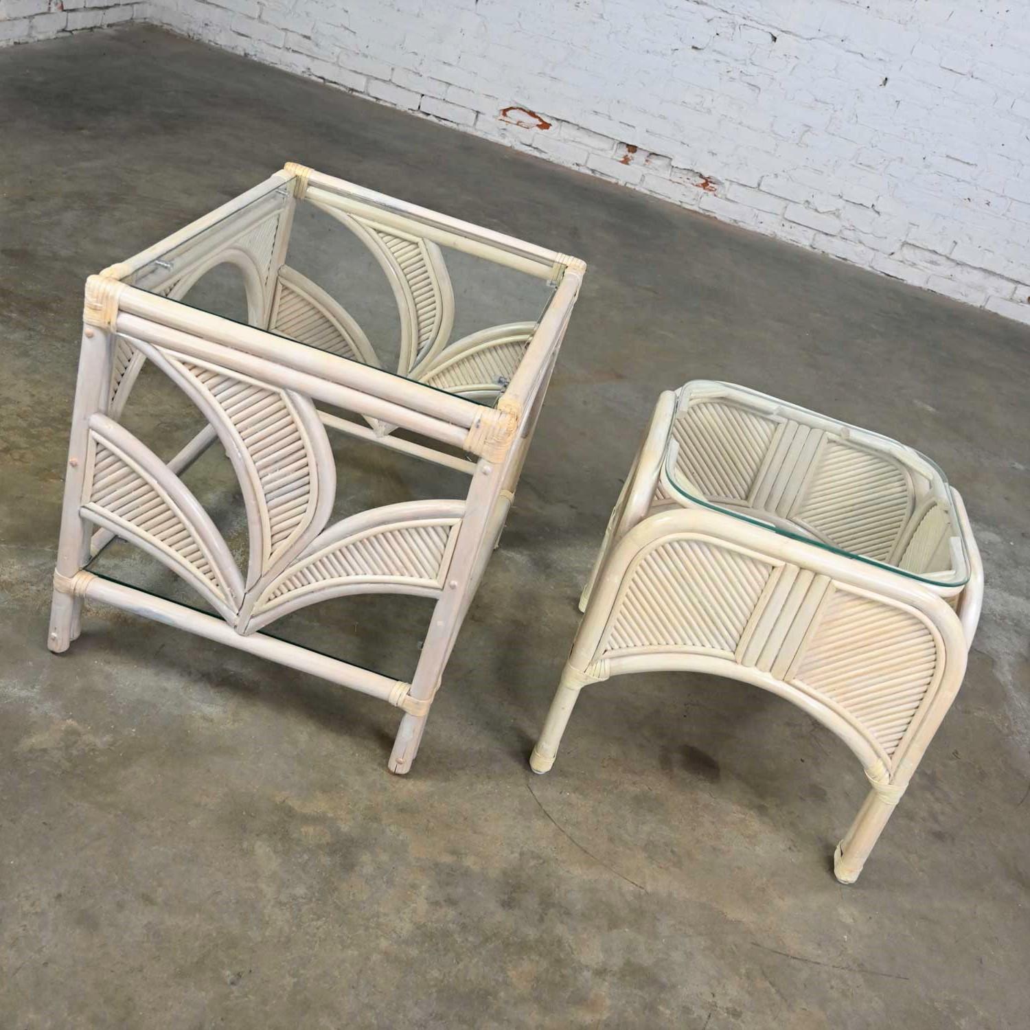 Lovely organic modern cerused reeded rattan 1 large and 1 small end table with glass tops. Beautiful condition, keeping in mind that these are vintage and not new so will have signs of use and wear. Color variances are inherent to the cerused