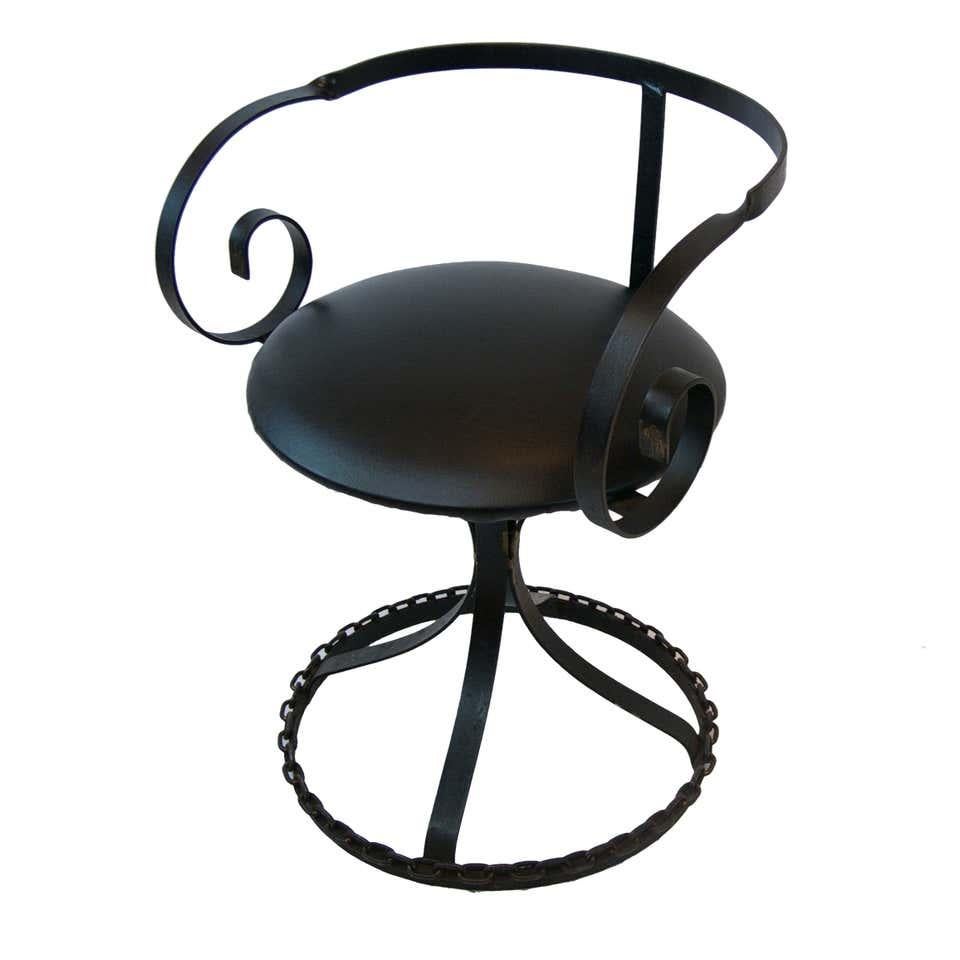 A very unique pair of iron curlicue arm swivel chairs in the style of George Mulhauser's Sultana design. Welded chain link base. 

Two pair available. Priced per pair.